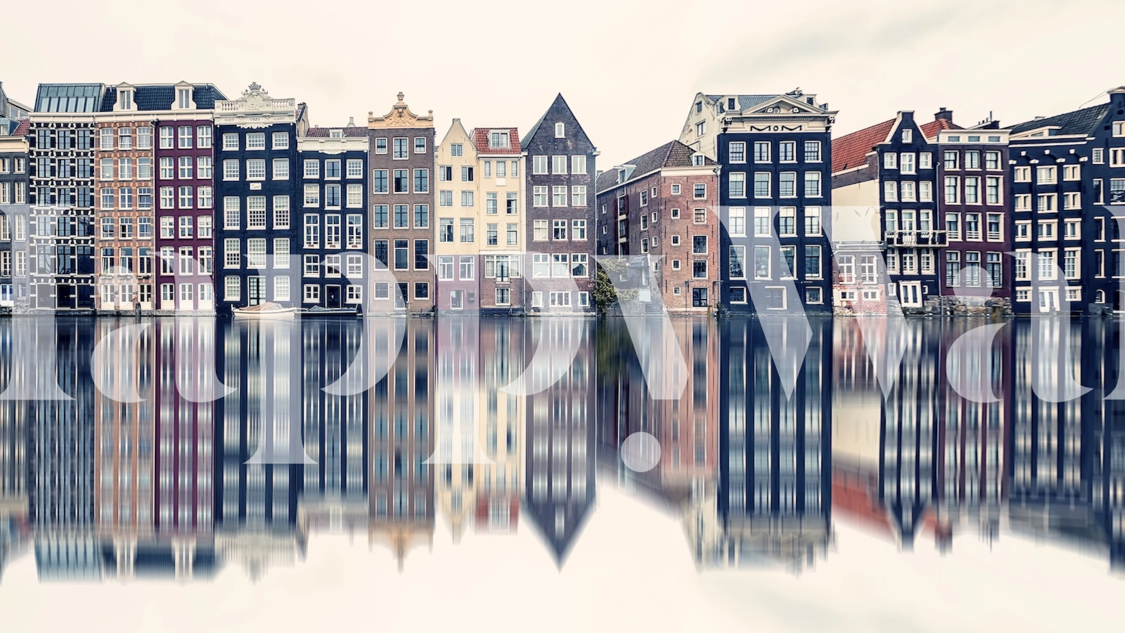 Amsterdam canal houses reflected in water wallpaper
