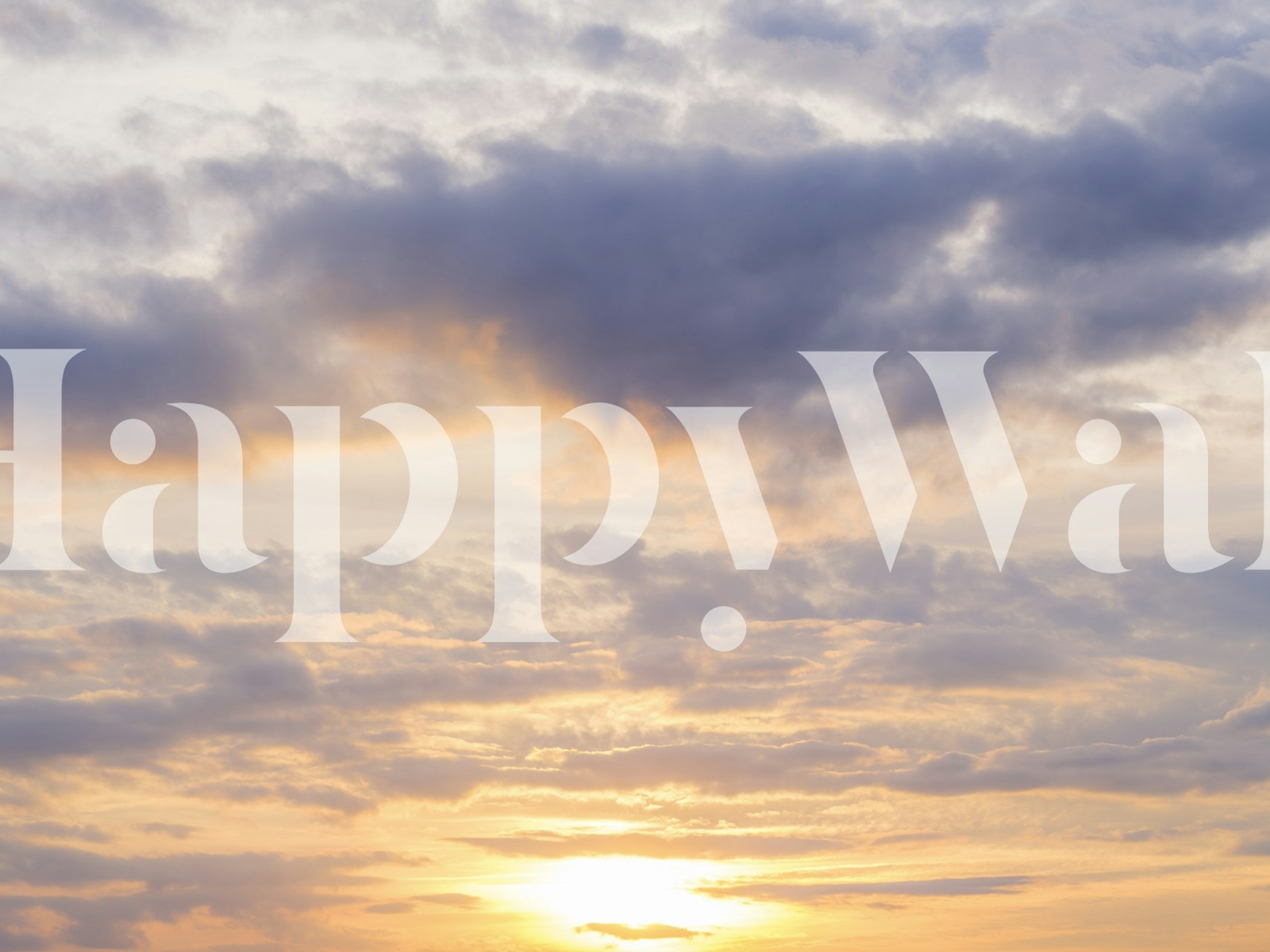 Cloudy sunrise with warm yellows and soft grays wallpaper