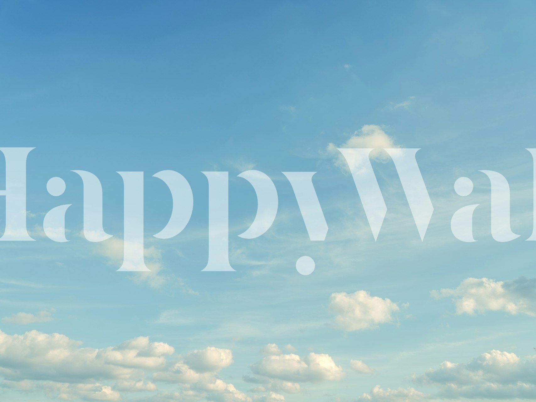 Serene blue sky with fluffy white clouds wallpaper