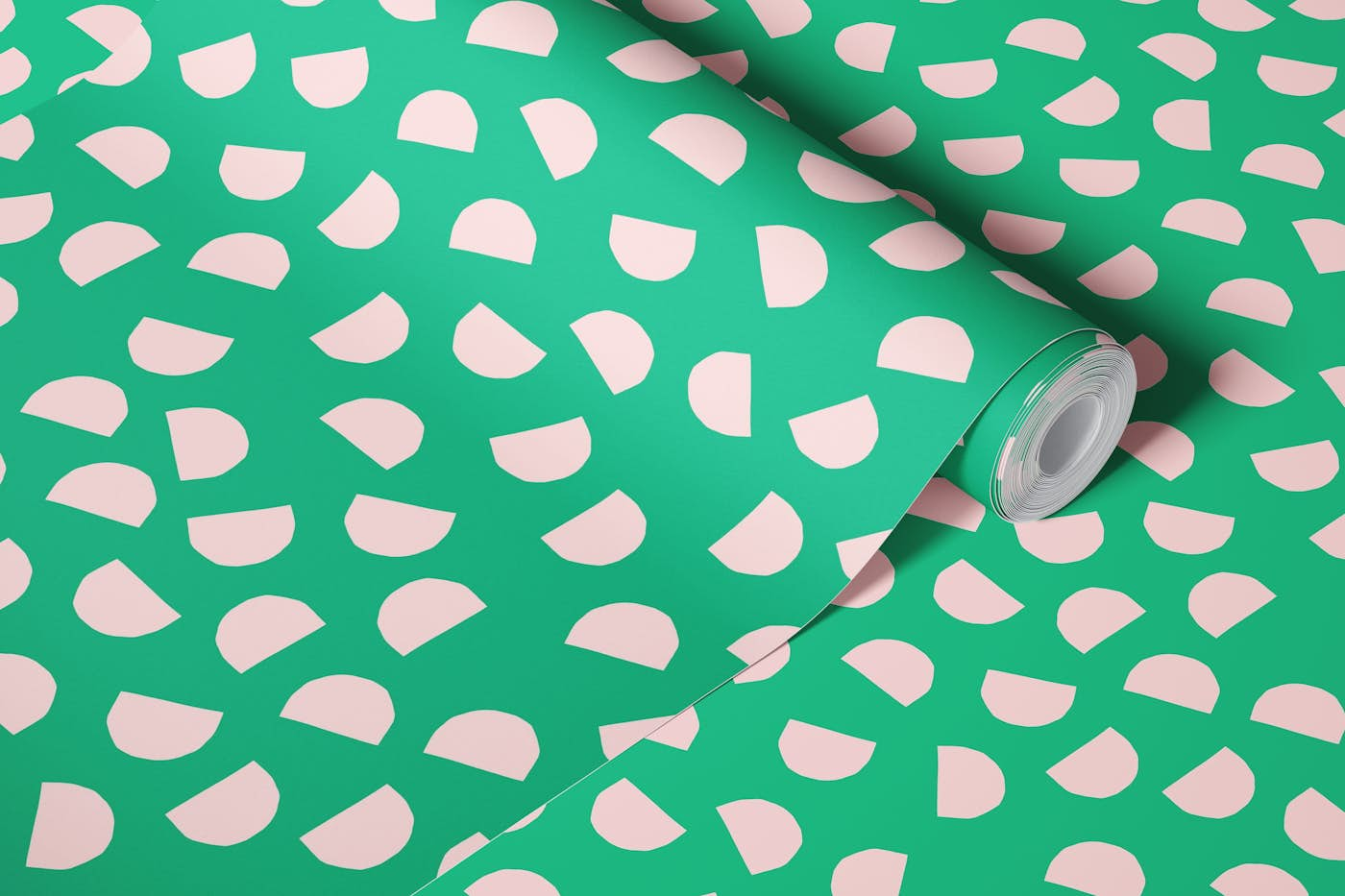 Pink half circle shapes on green wallpaper roll