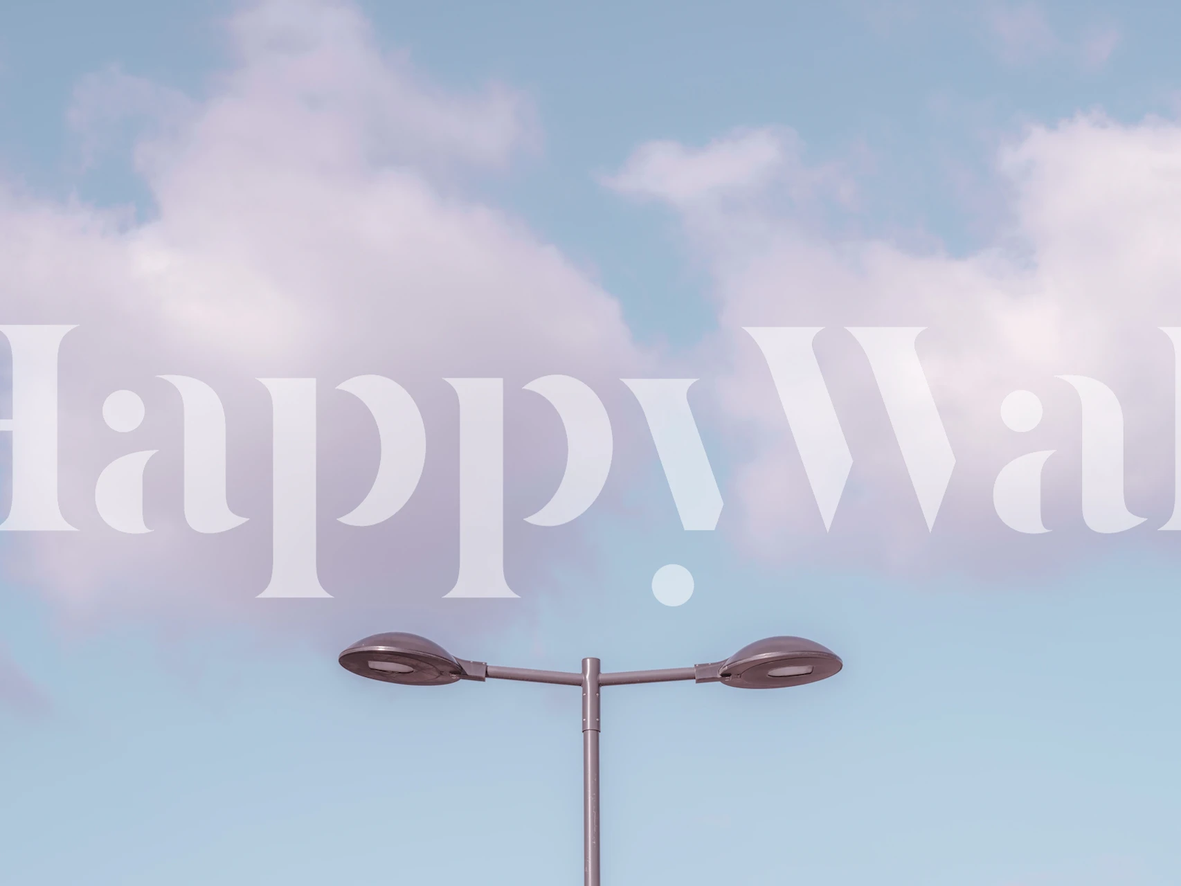 Street light against a blue sky with fluffy clouds wallpaper