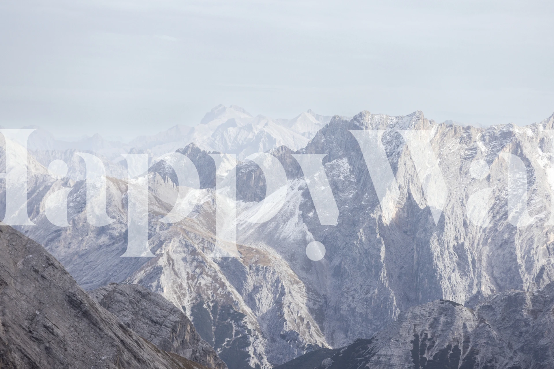 Mountain range in gray tones with snowy peaks wallpaper