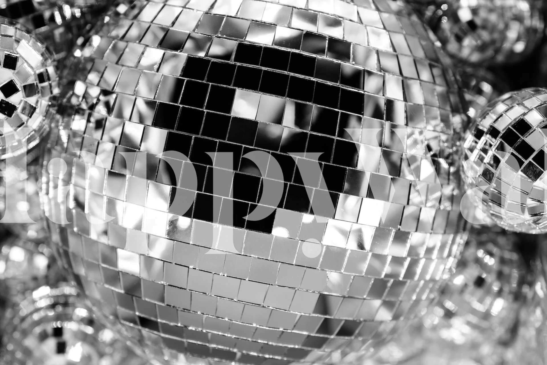 Close-up of disco balls with mirror tiles in black and white wallpaper