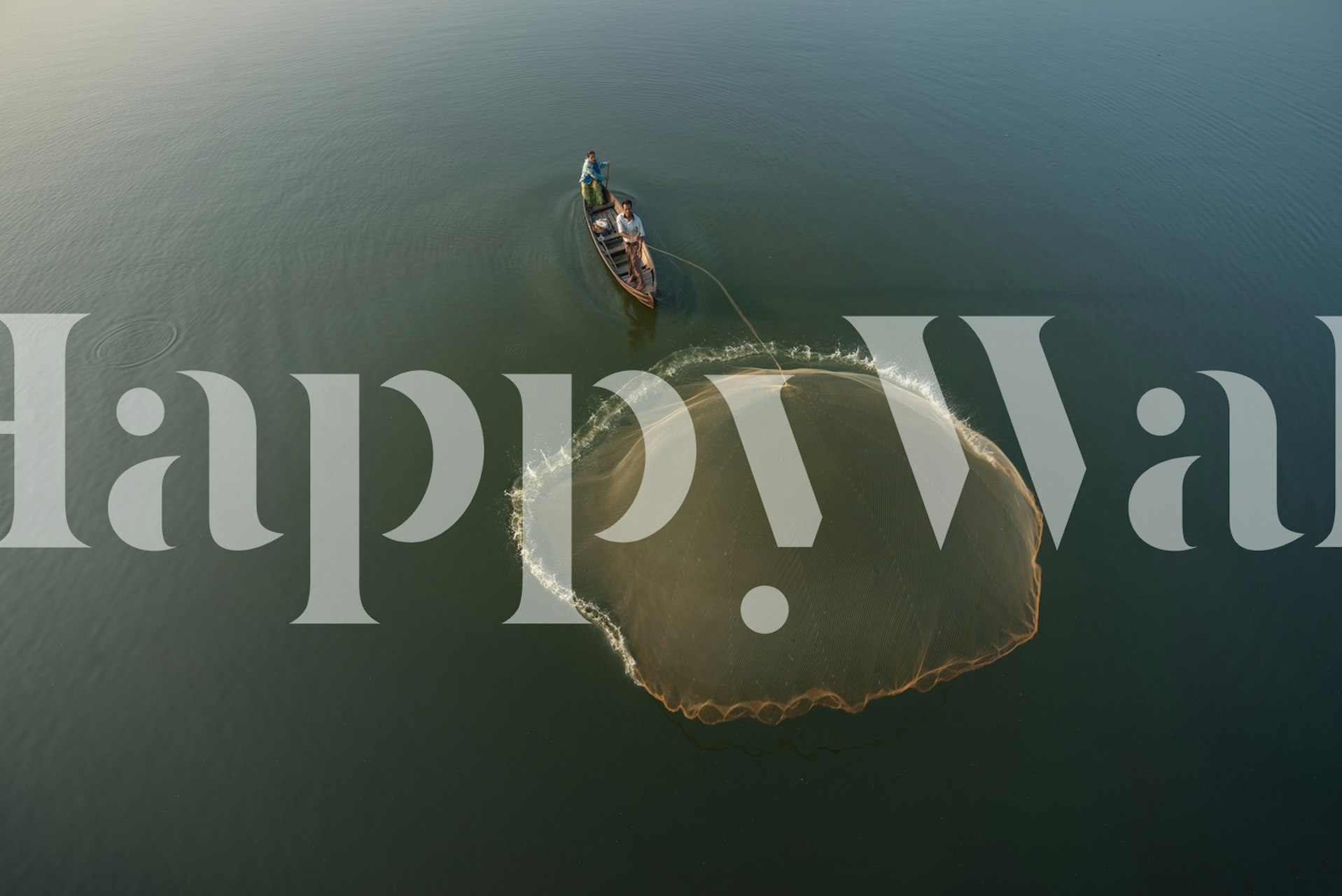 Fisherman casting a net in calm waters