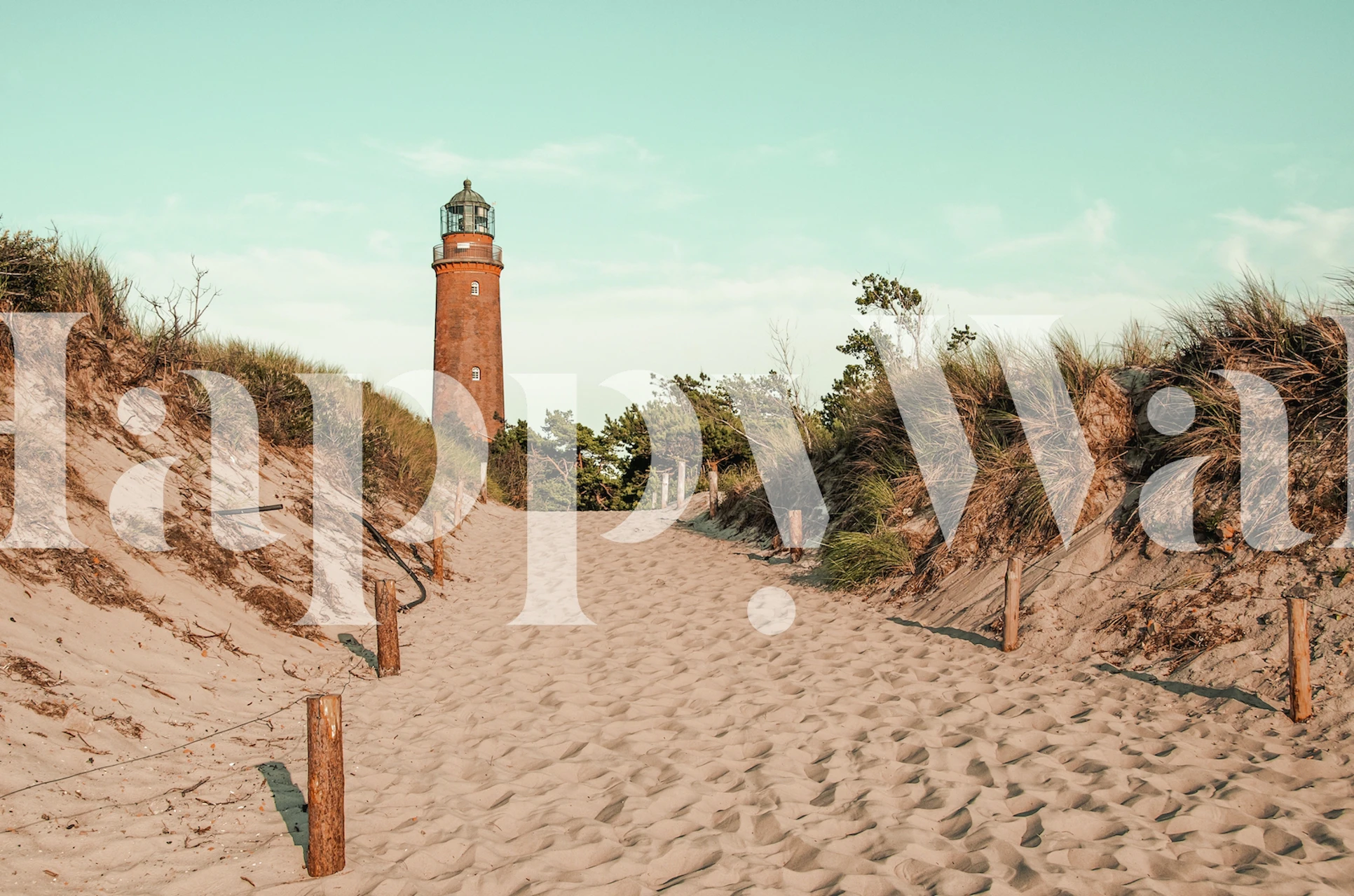 Lighthouse on sandy path with grass wallpaper