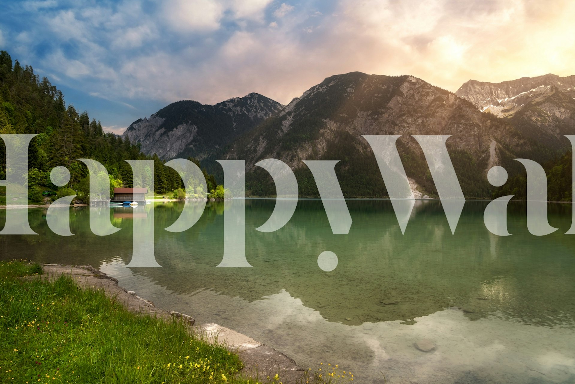 Scenic lake and mountain view in soft colors wallpaper