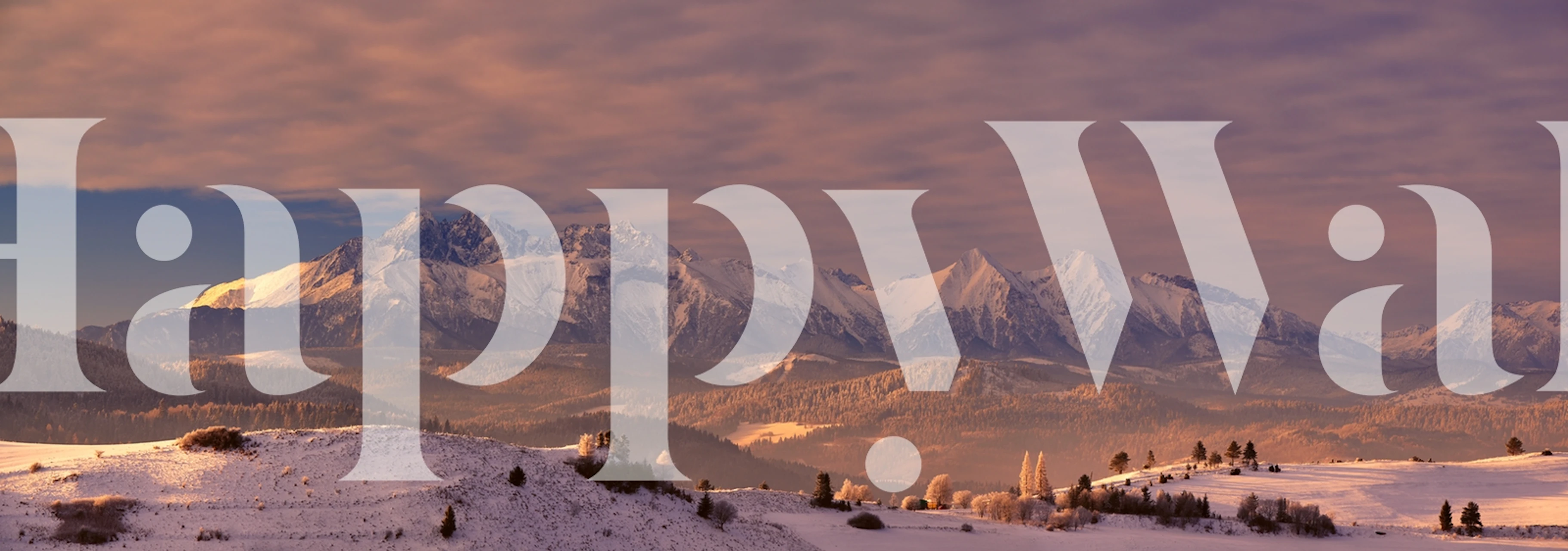 Tatra Mountains wall mural with snow-capped peaks and warm sky