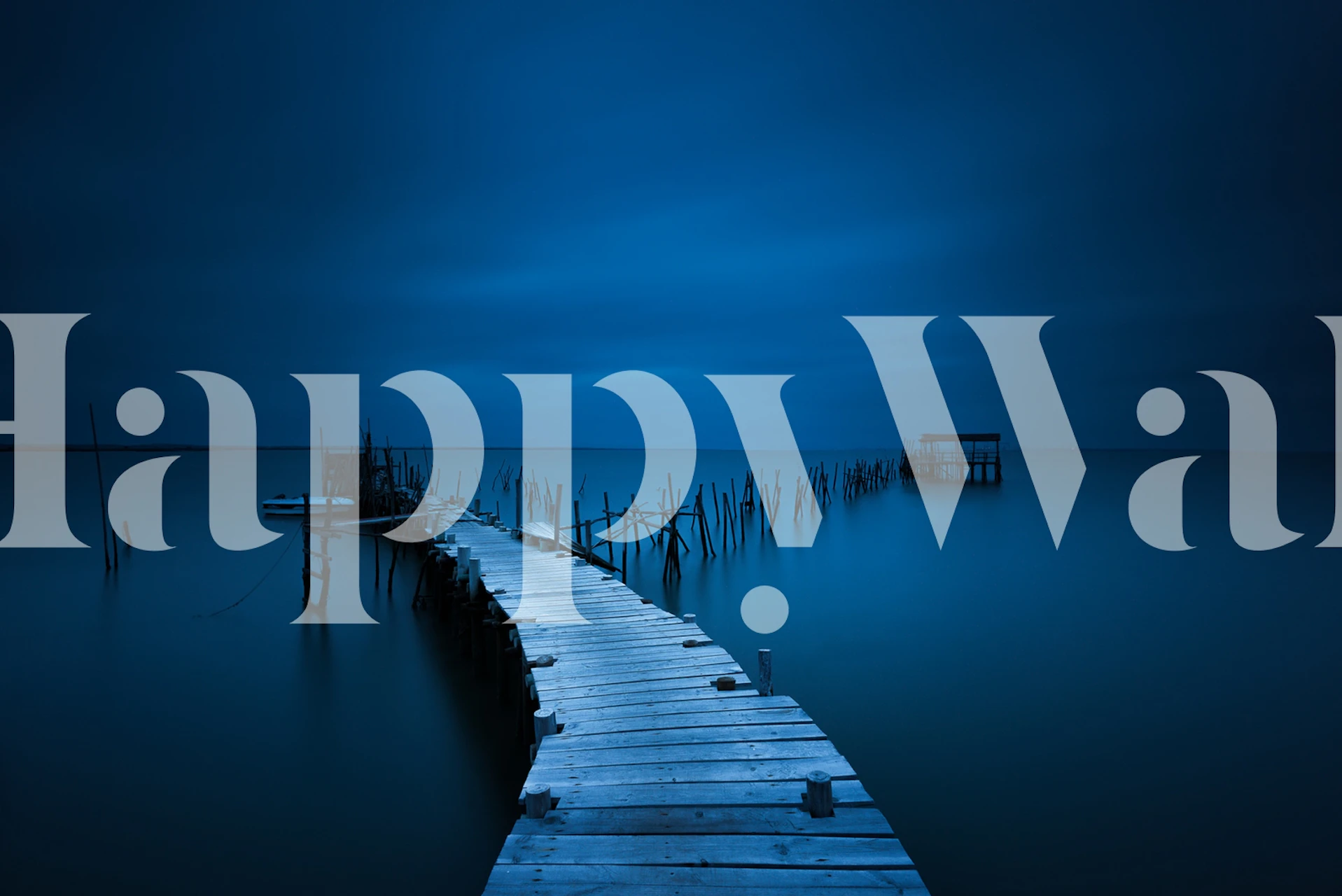 Wooden dock extending into calm blue waters wallpaper