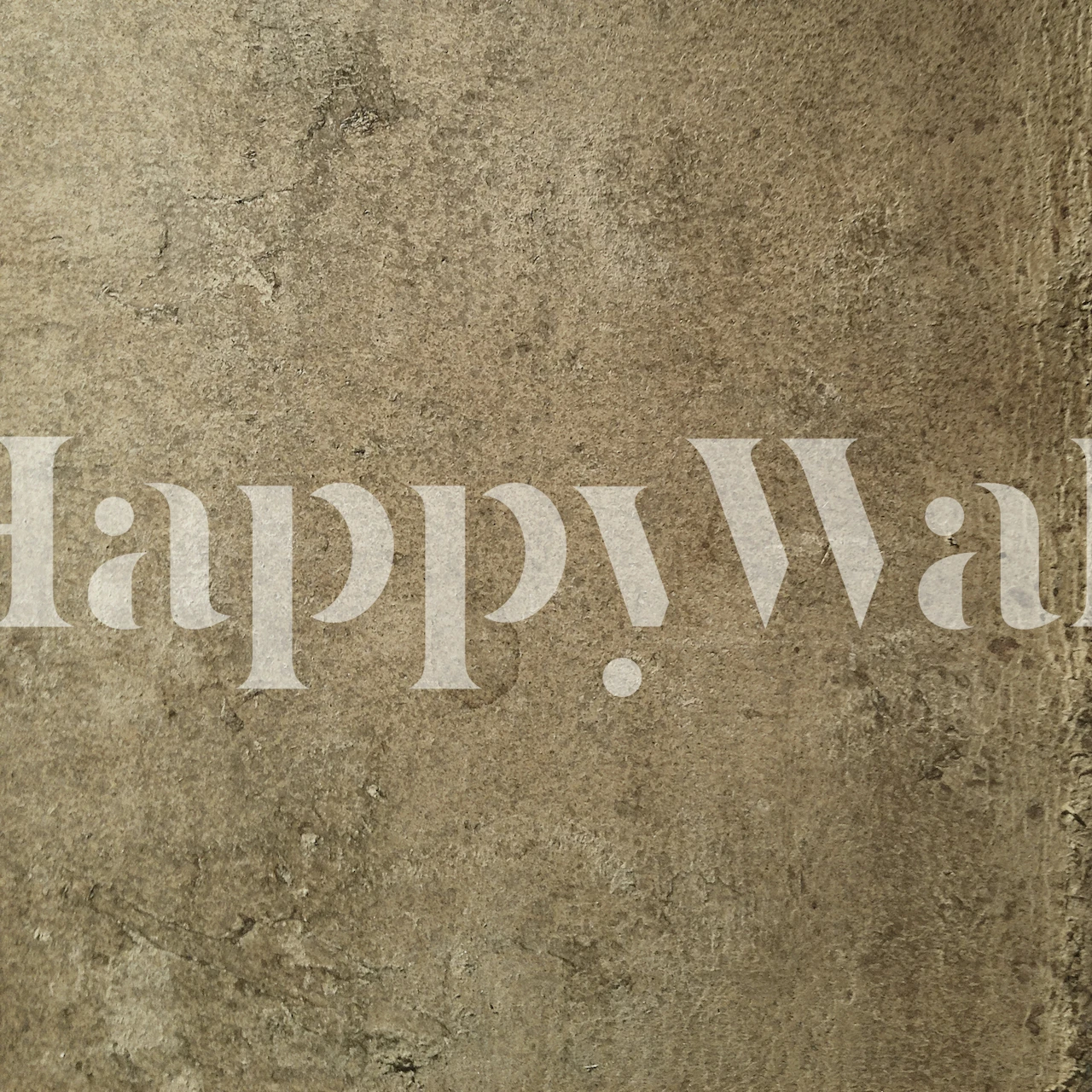 Textured aged leather look wallpaper in muted browns and grays