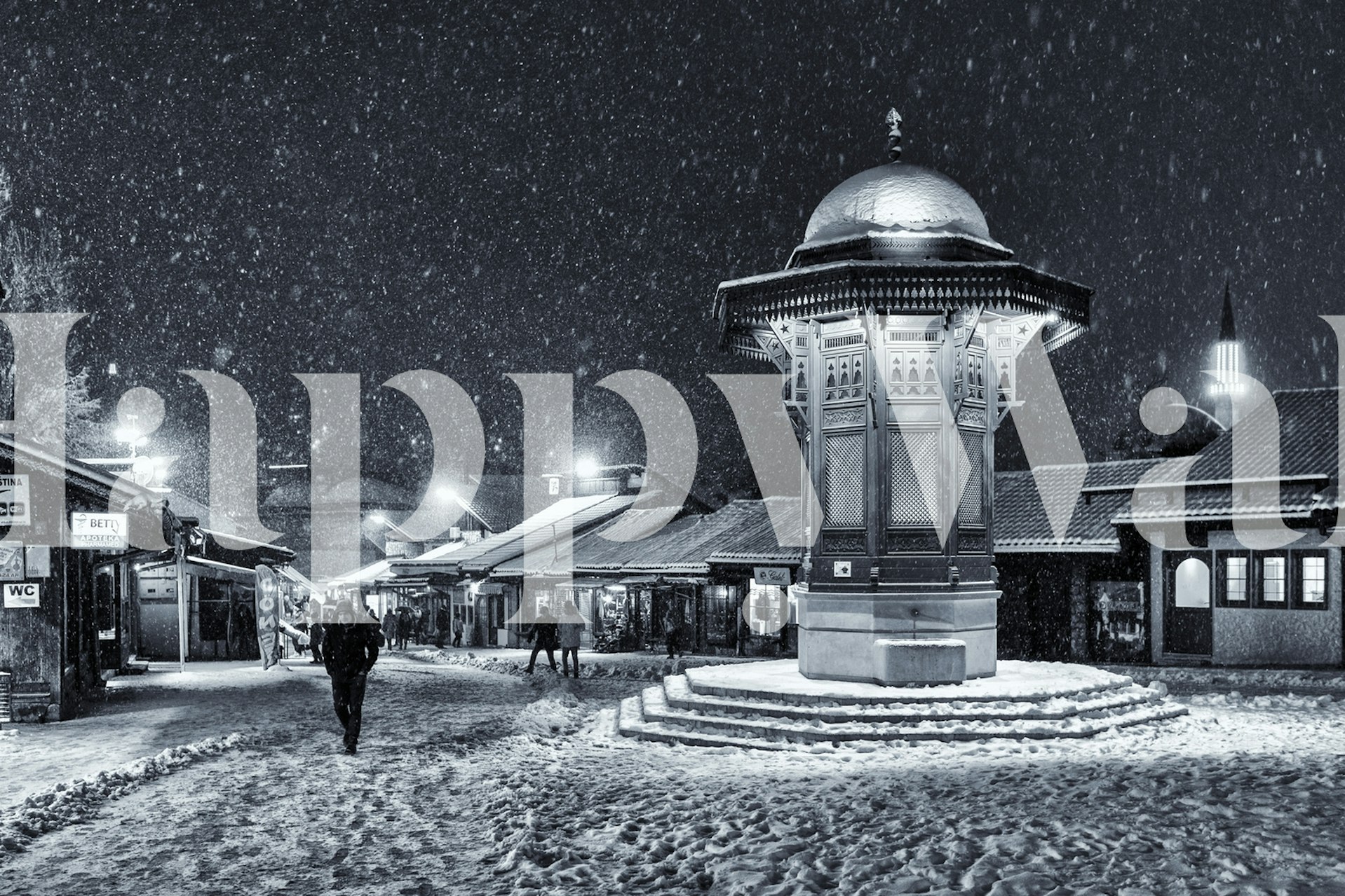 Black and white winter landscape with snow falling and city details wallpaper