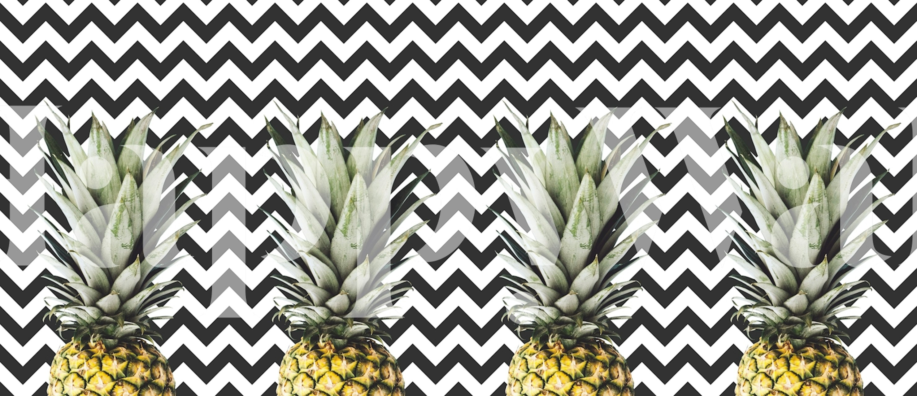 Tropical pineapple design on a black and white zigzag wallpaper