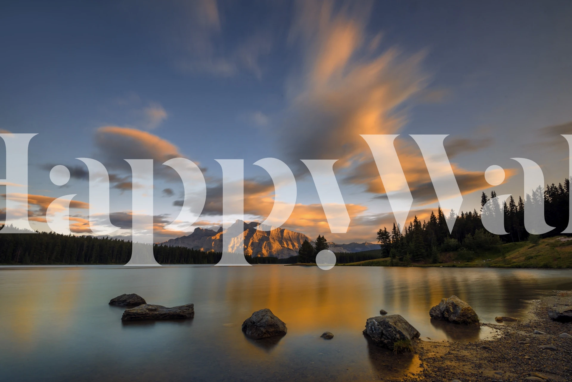 Mountain lake at sunset with orange clouds and rocks wallpaper