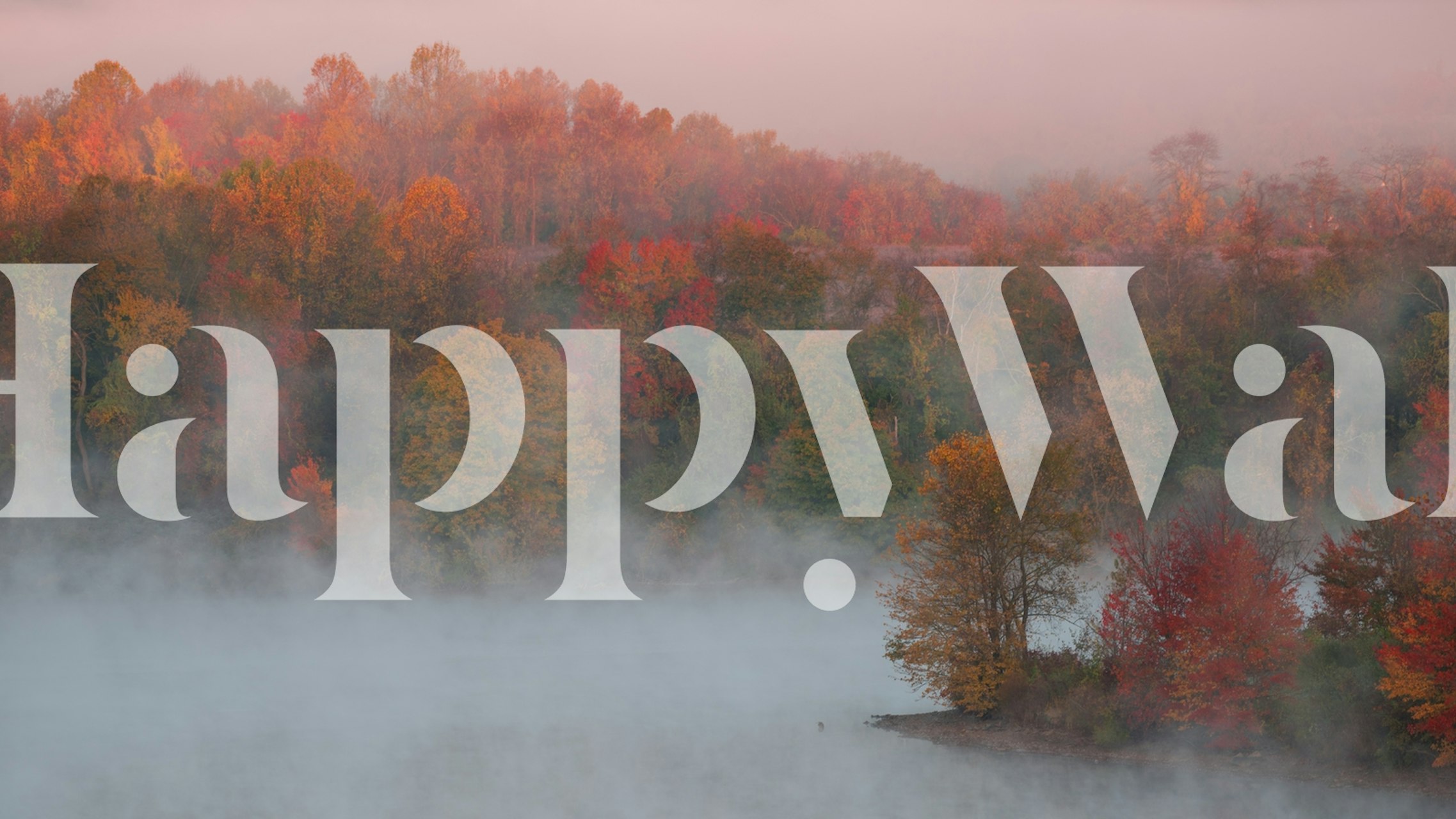 Autumn landscape wallpaper with foggy mountains and colorful trees