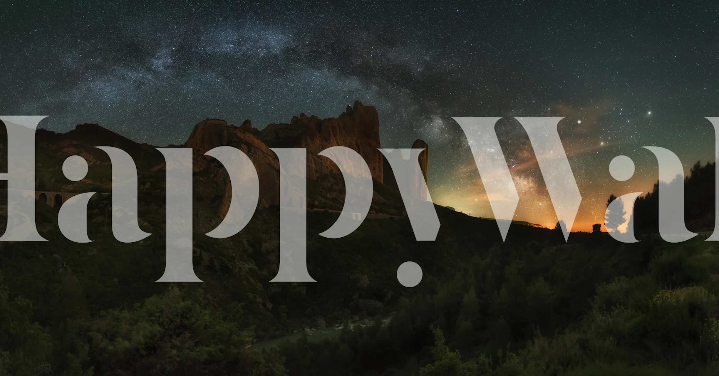 Rocky cliffs under starry night sky wallpaper