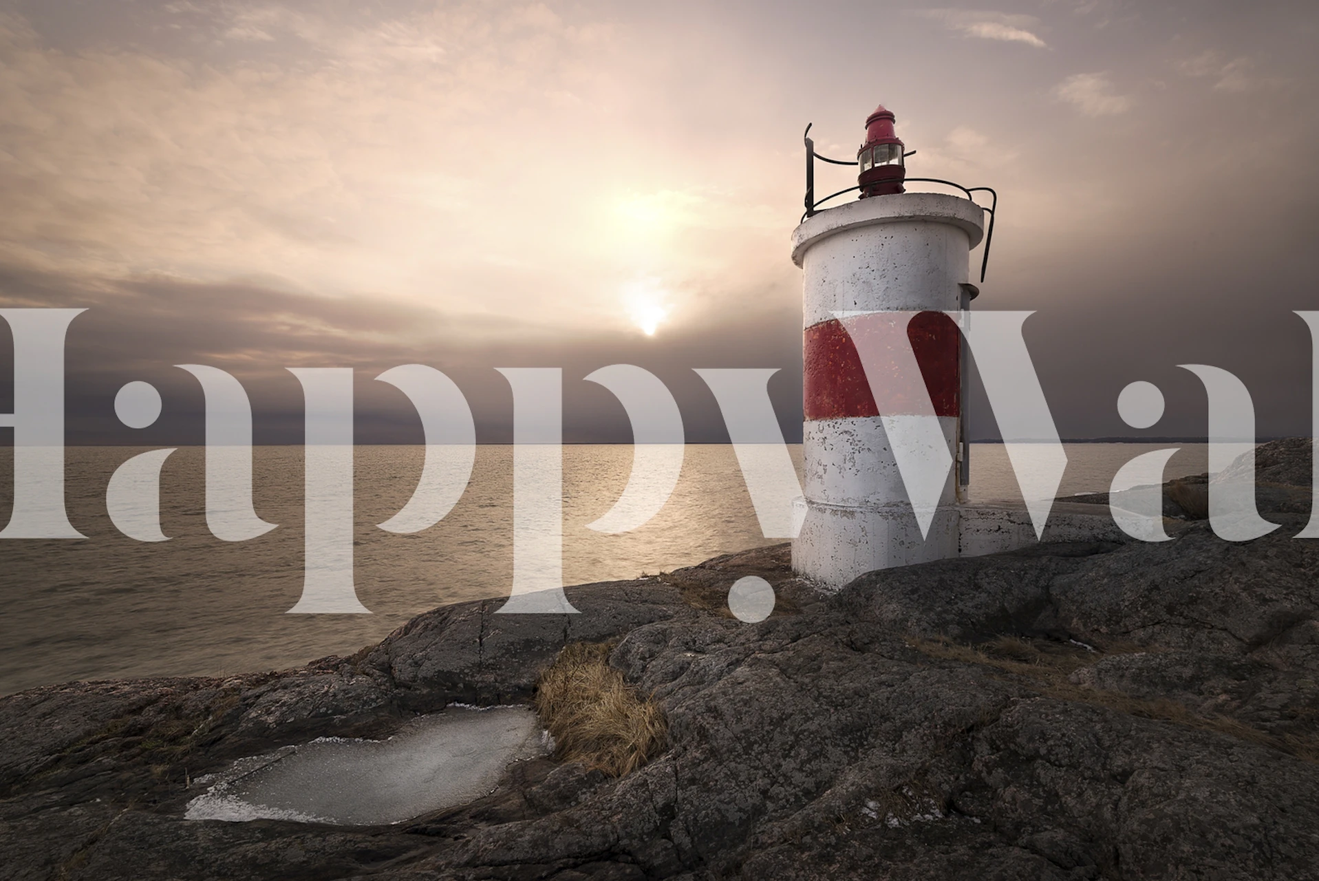 Lighthouse on rocky shore during sunset wallpaper