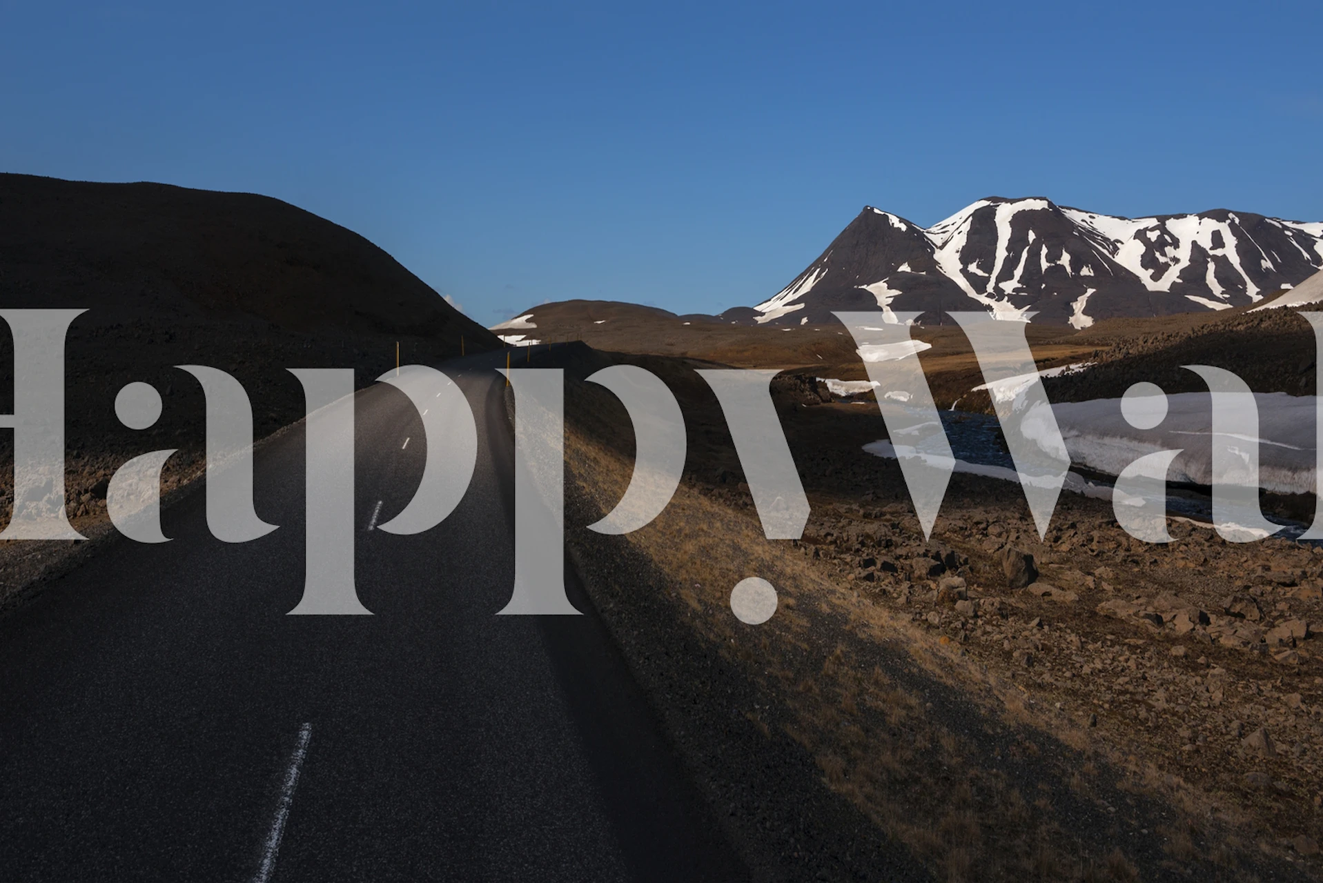 Open highway with mountains in the background wall mural