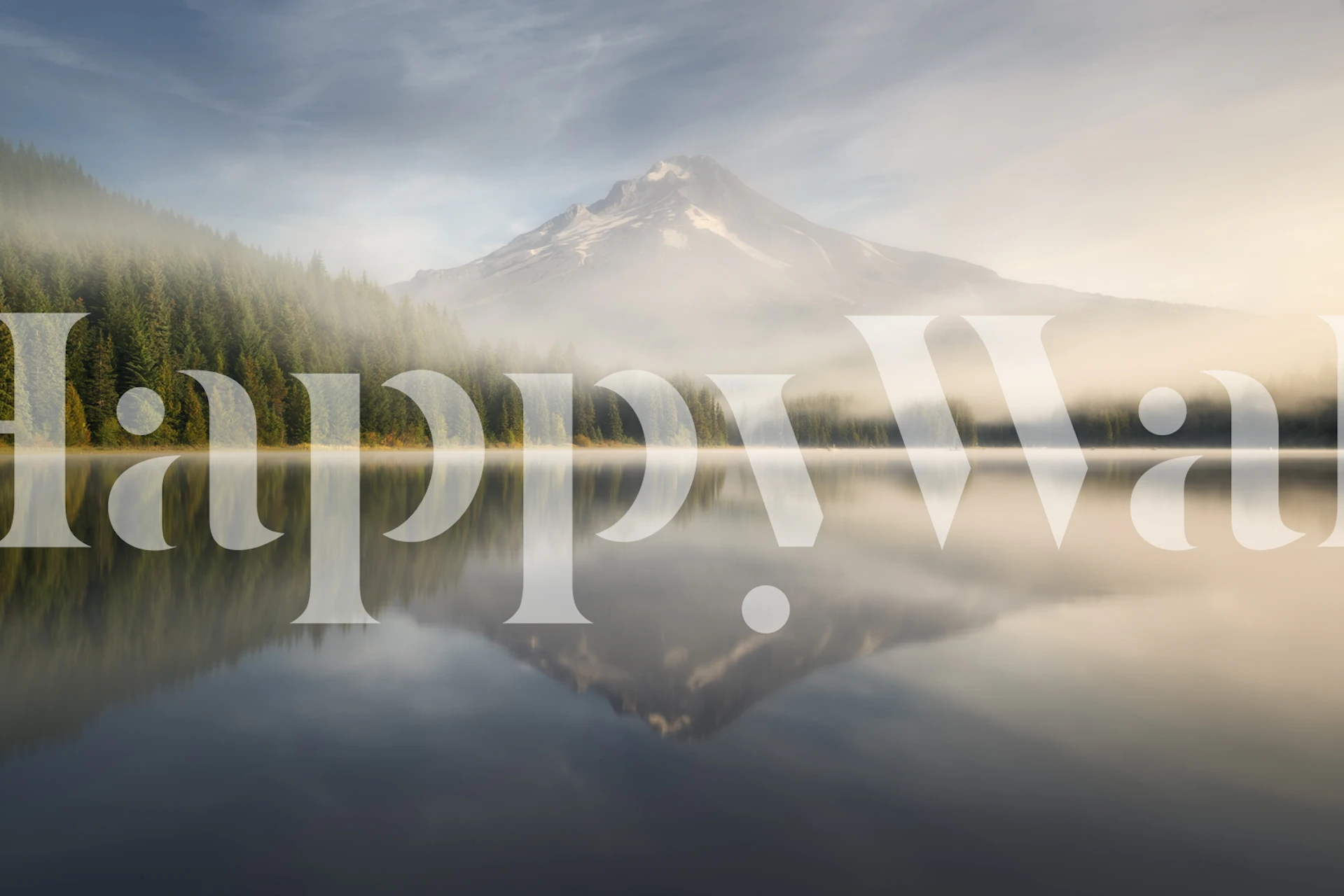 Mountain lake reflection with mist and greenery wallpaper