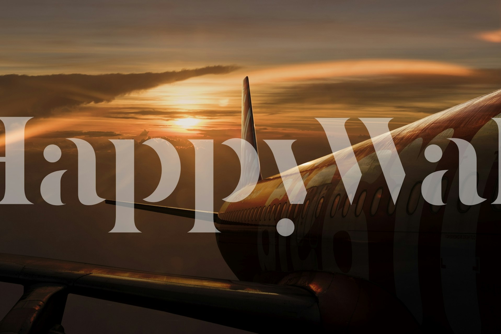 Airplane wing against a sunset sky with vibrant orange and blue hues wallpaper