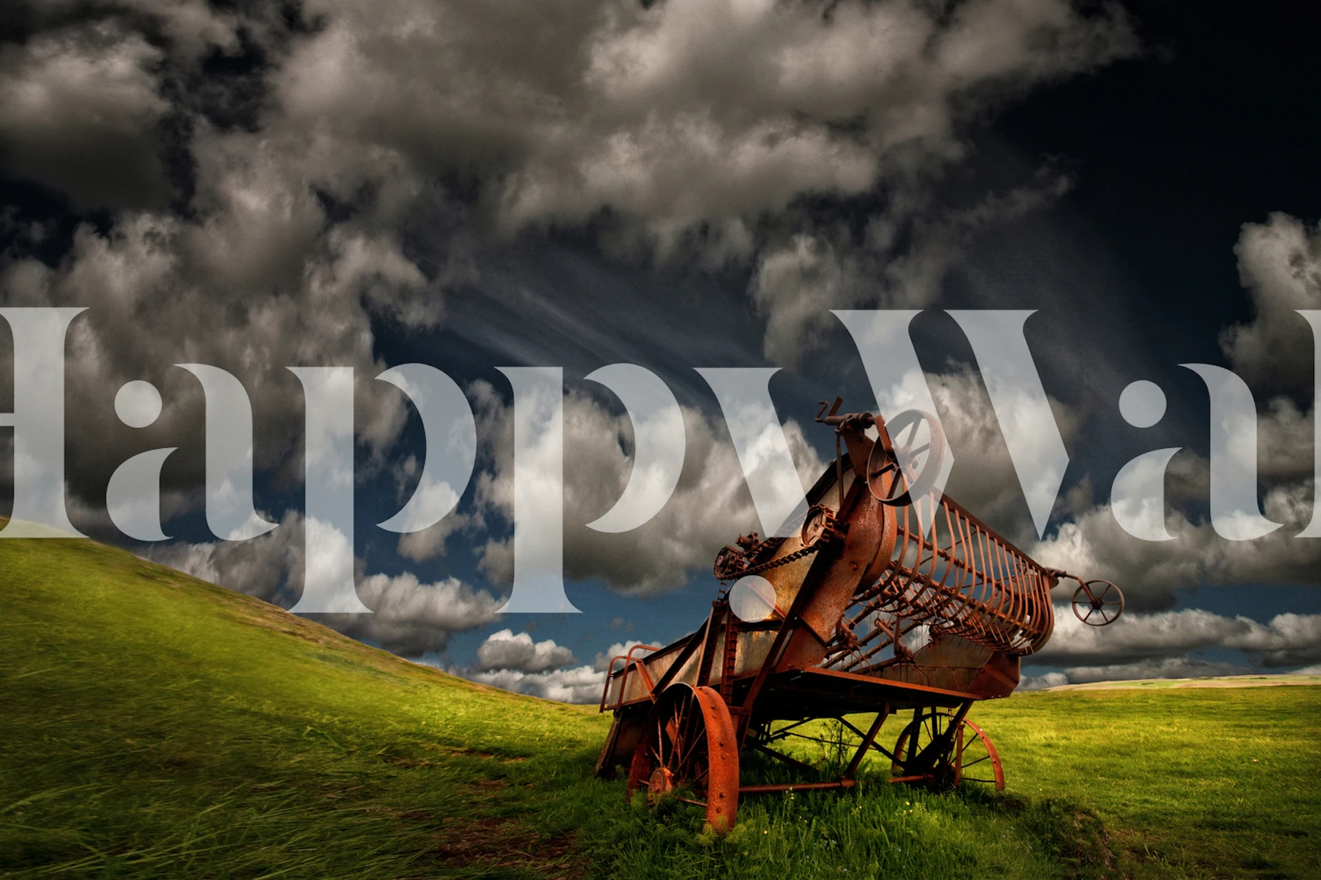 Old rusted harvester in green field under dramatic clouds wallpaper