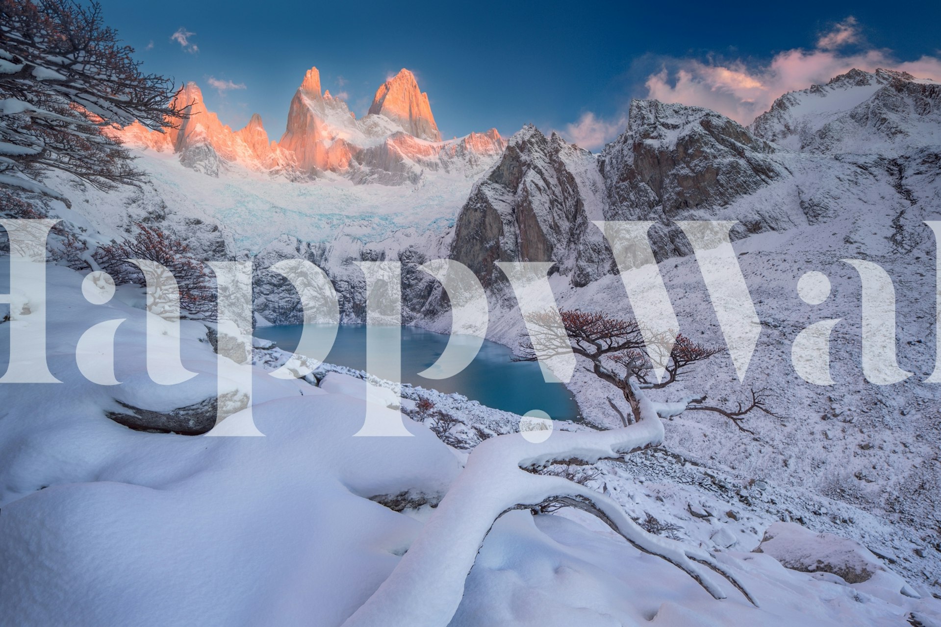 Snow-covered mountain landscape with lake and trees wallpaper