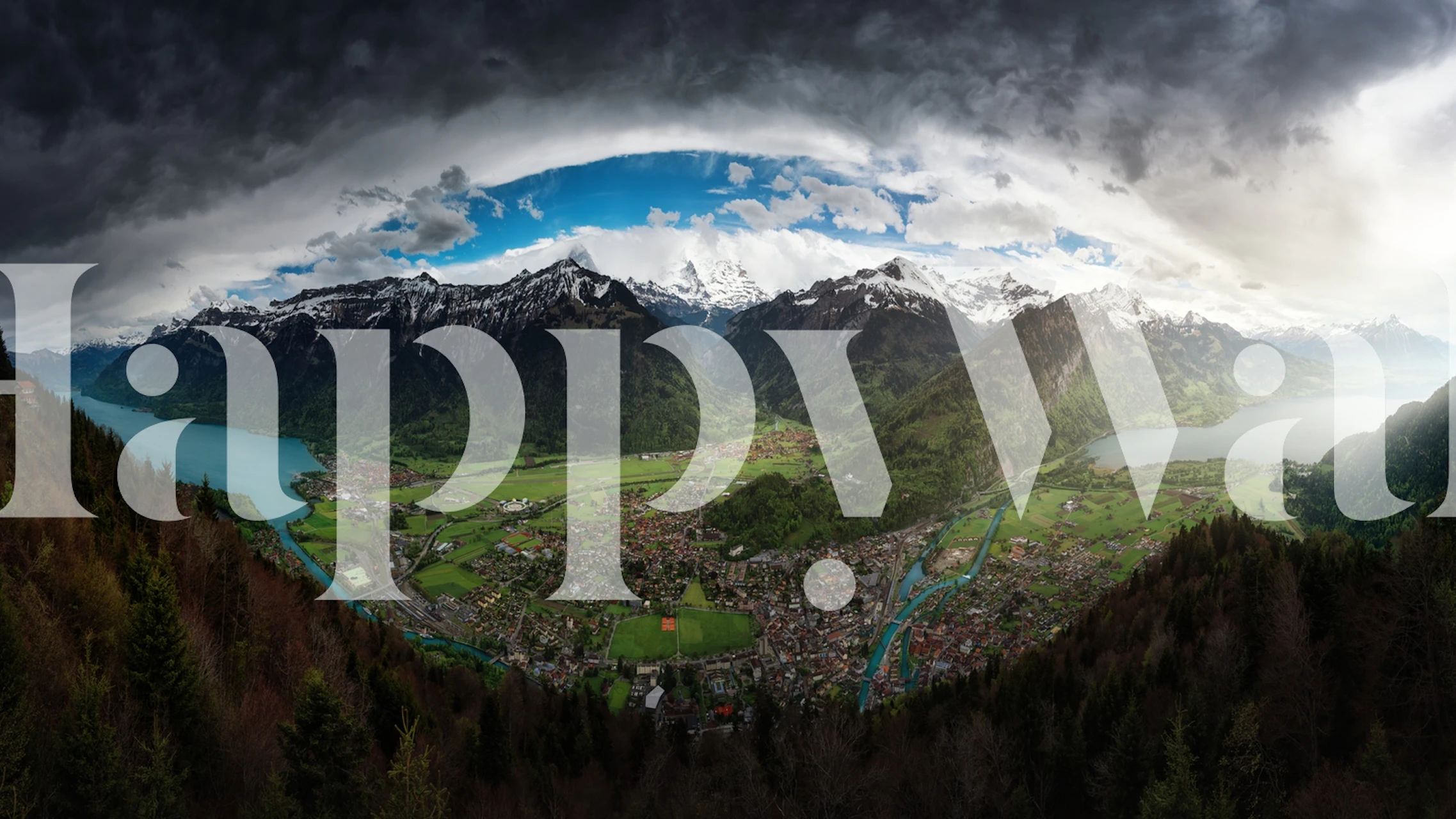 Mountain landscape with clouds, blue sky, and green hills wallpaper