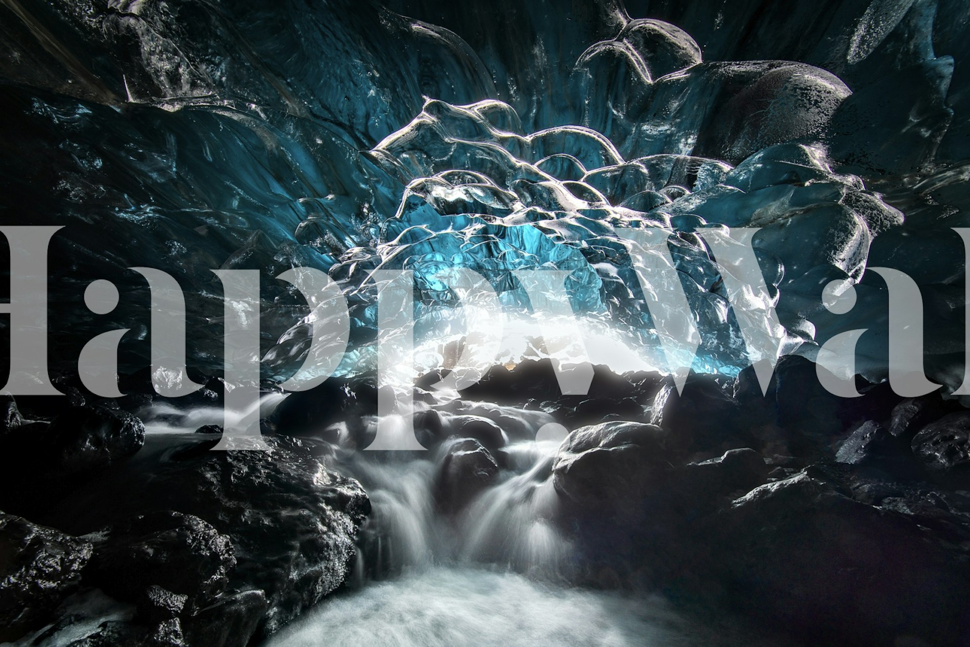 Icy blue glacier cave with water and rocks wallpaper