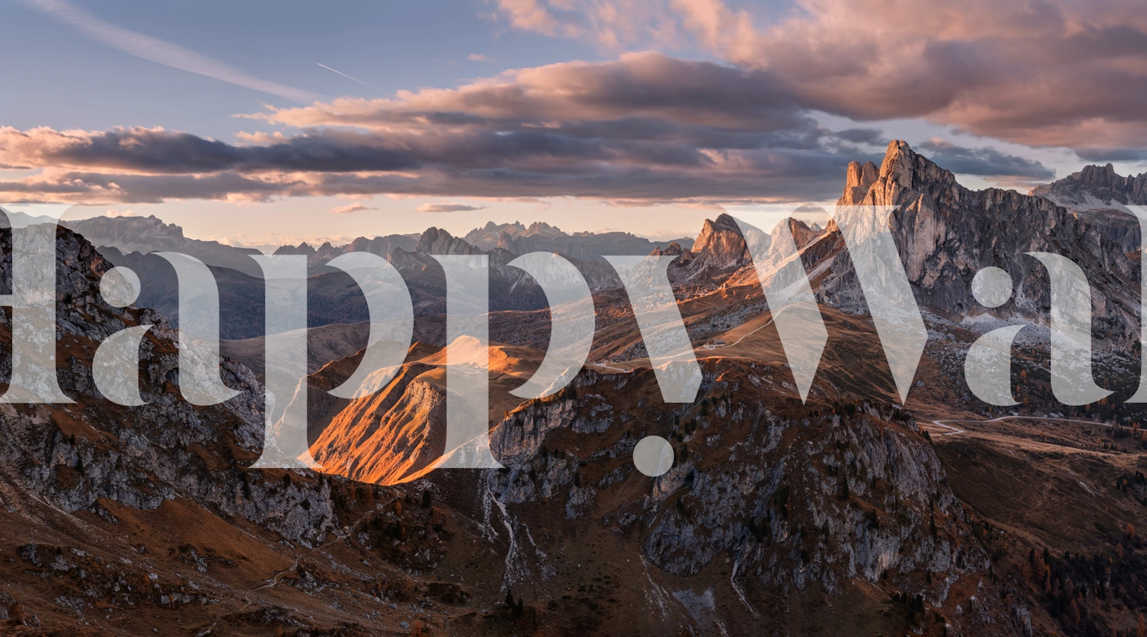 Mountain landscape with rocky peaks and sunset colors wallpaper