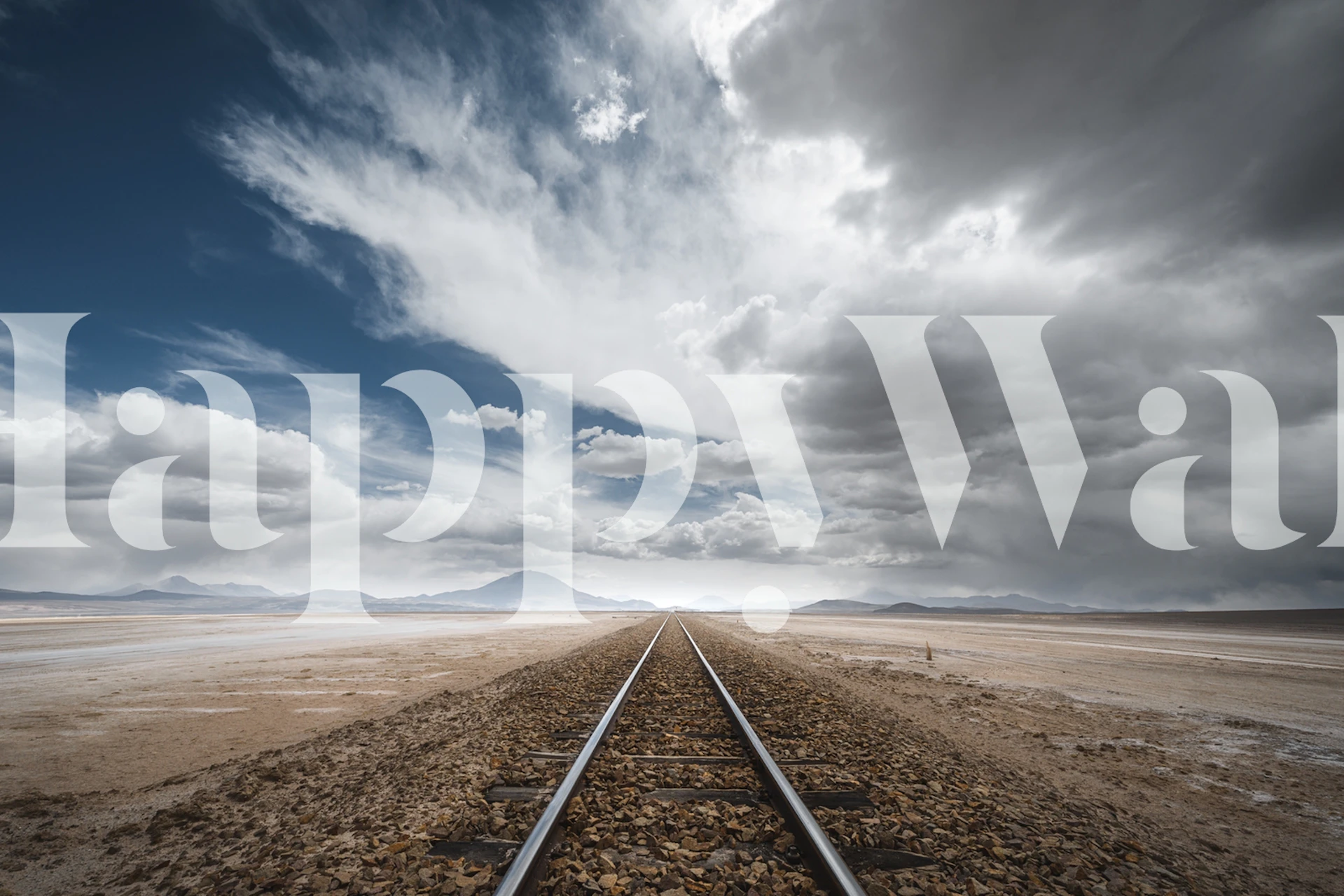 Scenic railway track with dramatic clouds and blue sky wallpaper