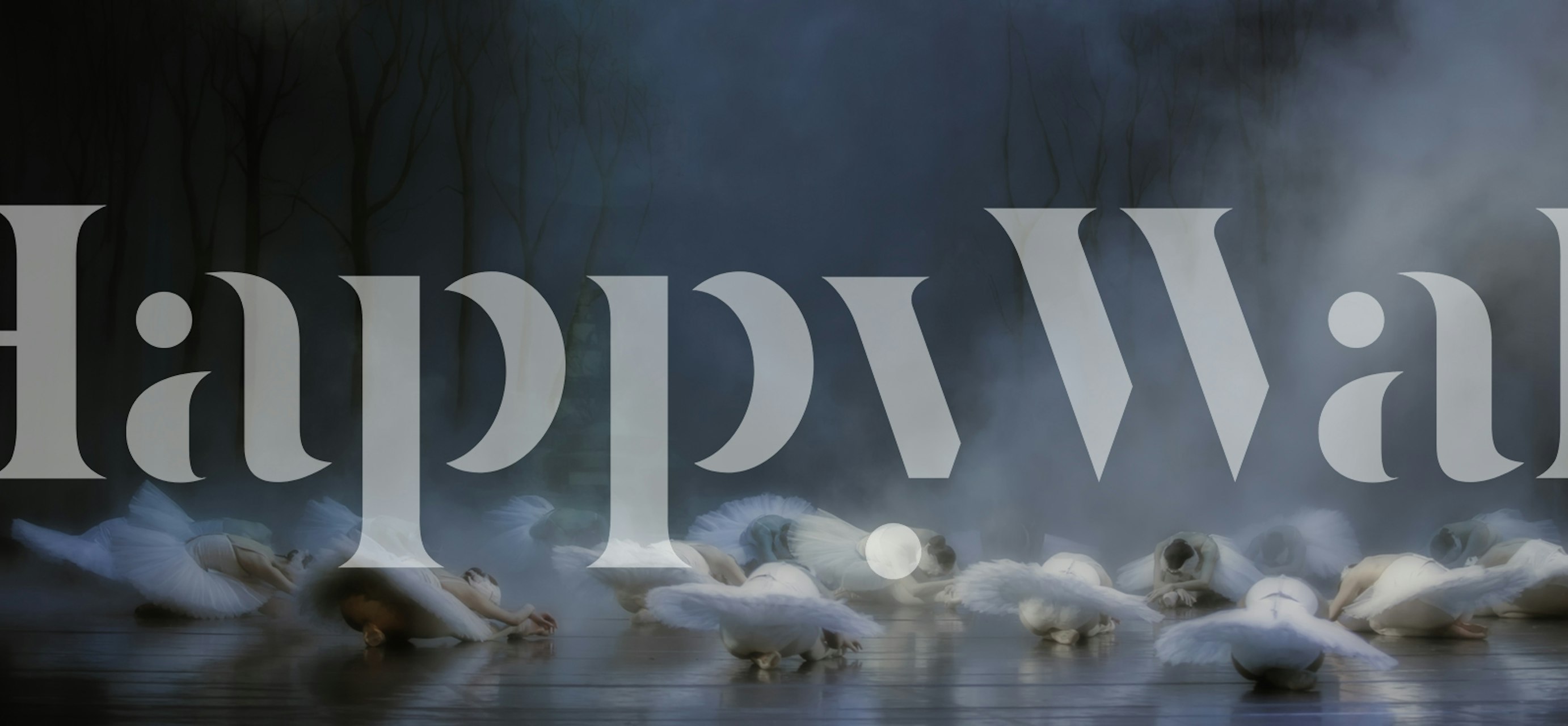 A serene scene of white swans on a misty lake wallpaper