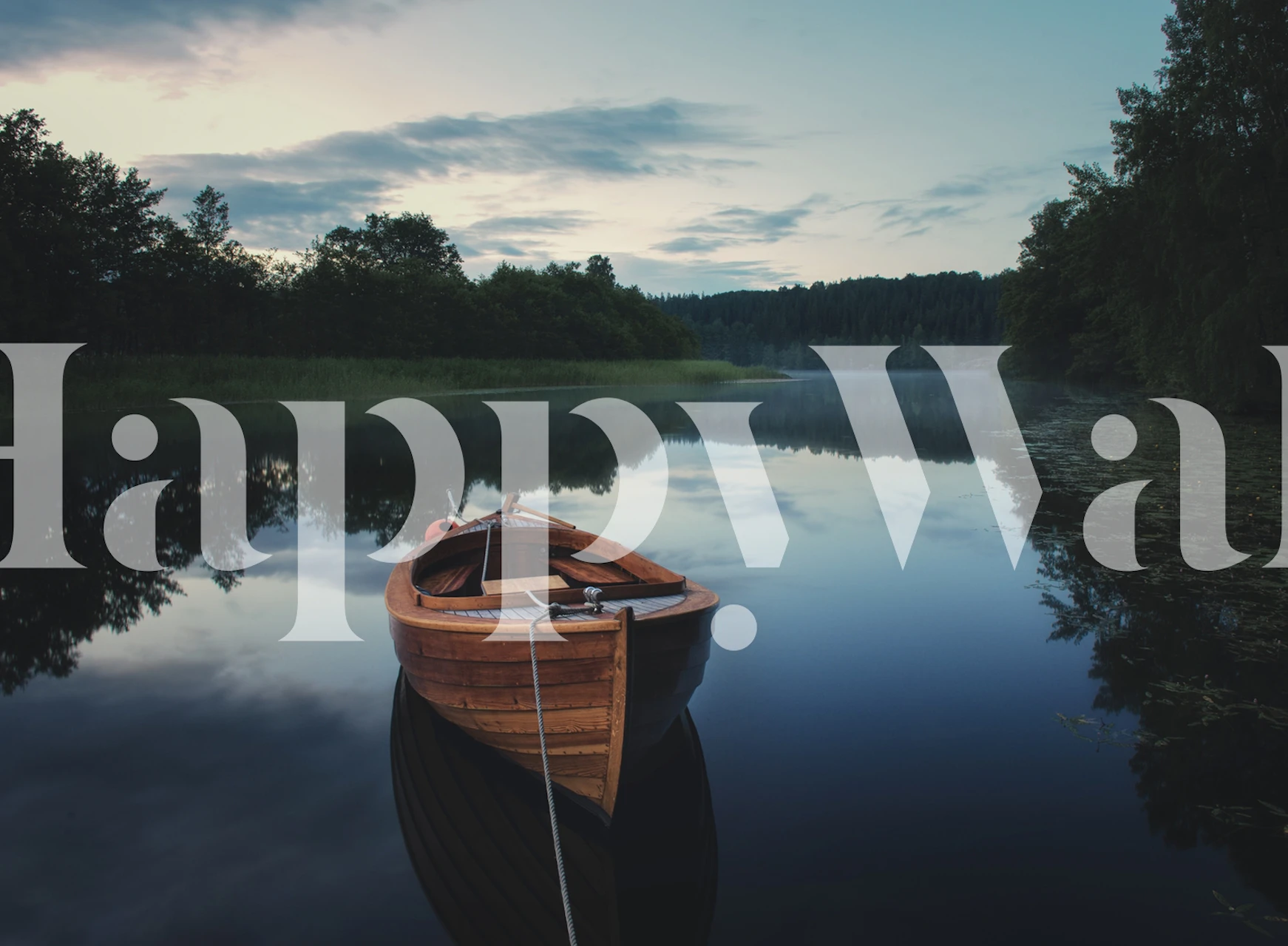 Wooden boat on still lake at dusk with trees and water reflections wallpaper