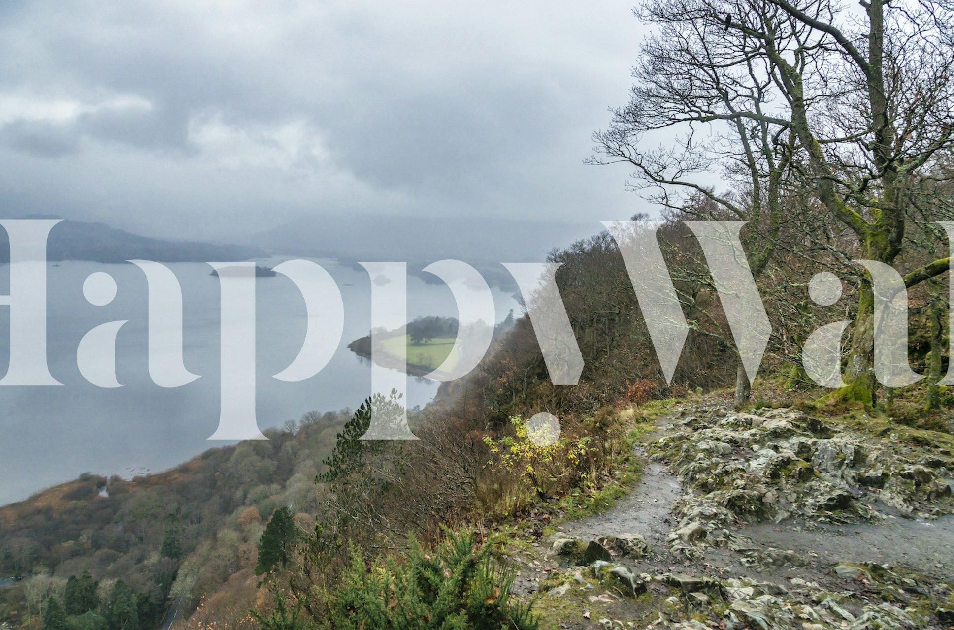 Scenic British Lake District view with misty hills and water wallpaper