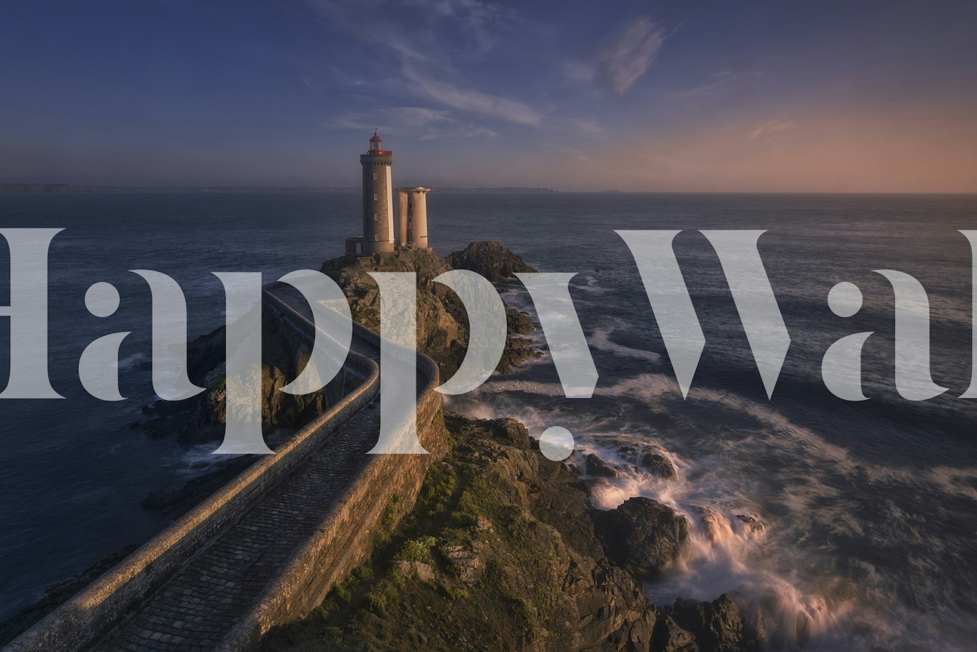 Lighthouse on rocky coast at sunset wallpaper