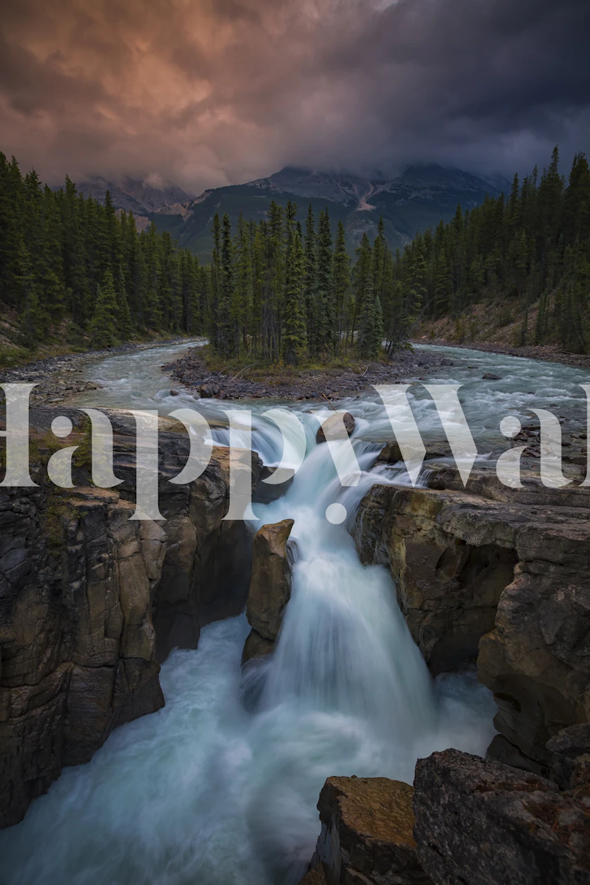 Waterfall cascading over rocks with pine trees and dark sky wallpaper