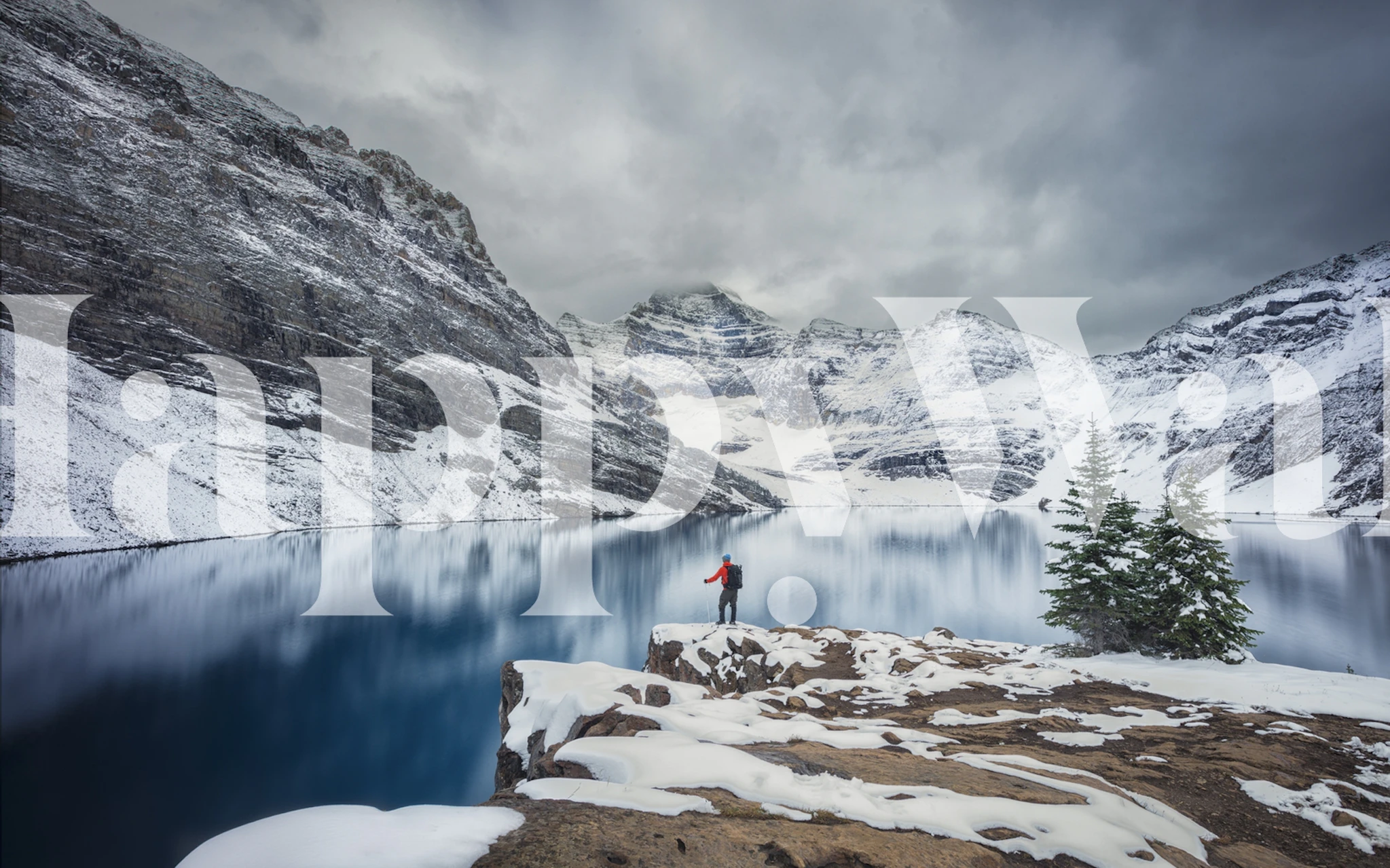 Snowy mountain landscape with lake and pine trees wallpaper
