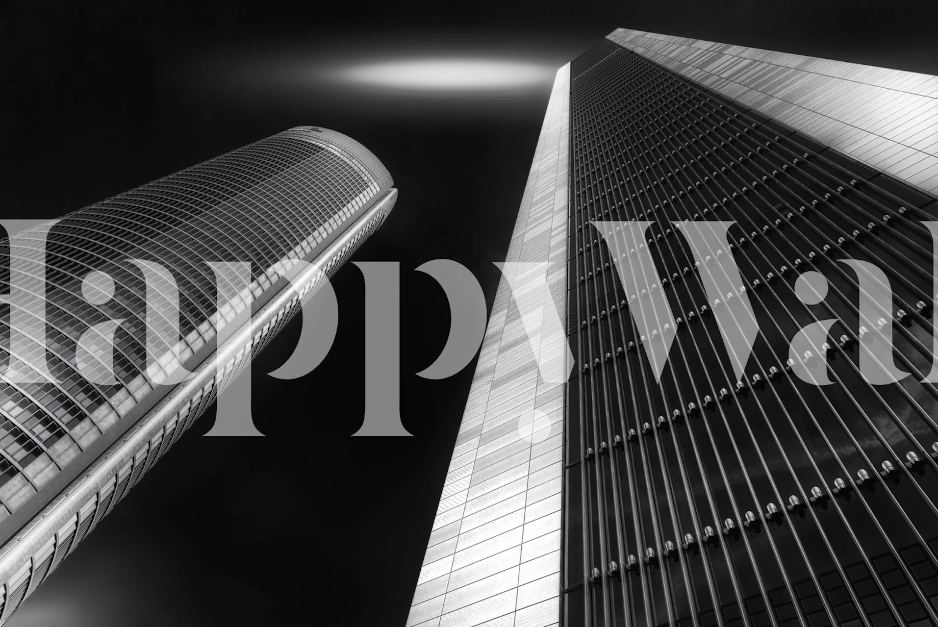Tall black and white skyscrapers with a dramatic angle view wallpaper