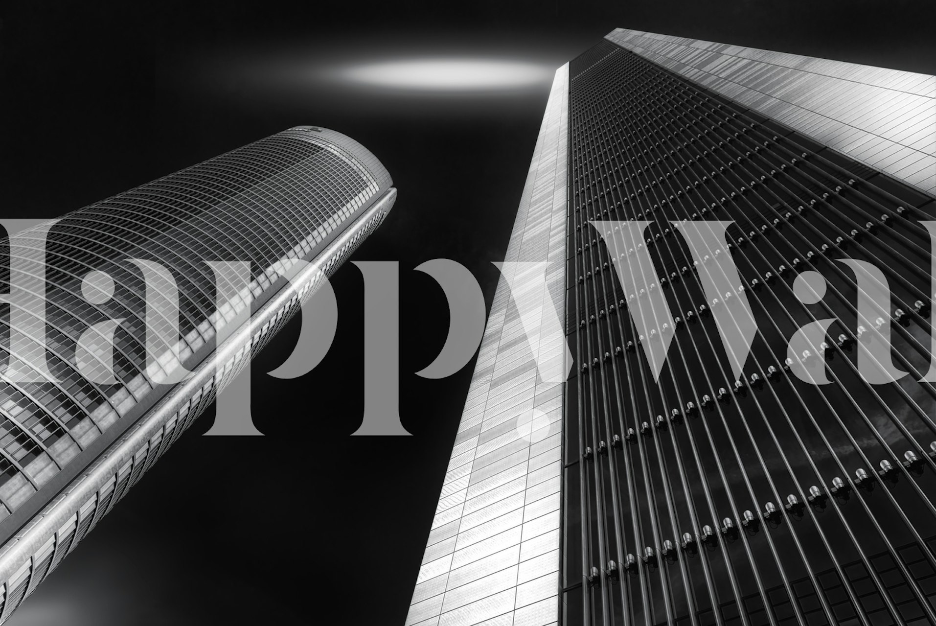 Tall black and white skyscrapers with a dramatic angle view wallpaper