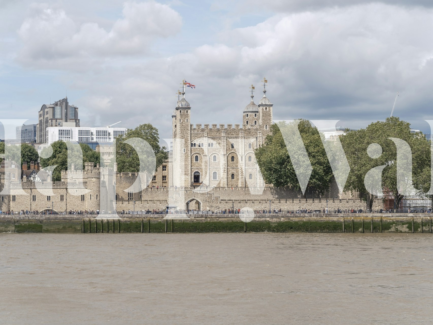 Tower of London stone castle with trees and cloudy sky wallpaper