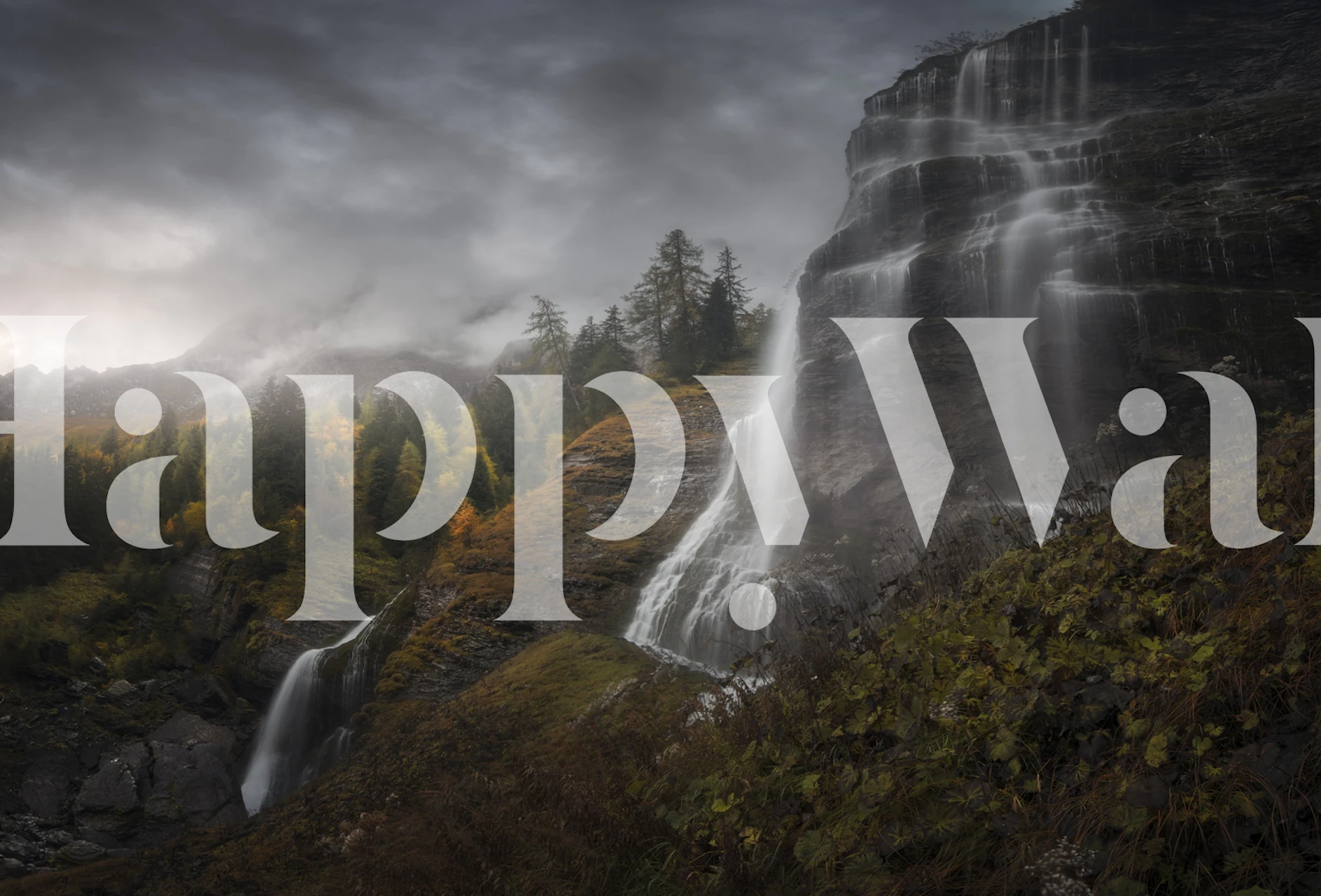 Majestic waterfall cascading down rocky mountain landscape wallpaper