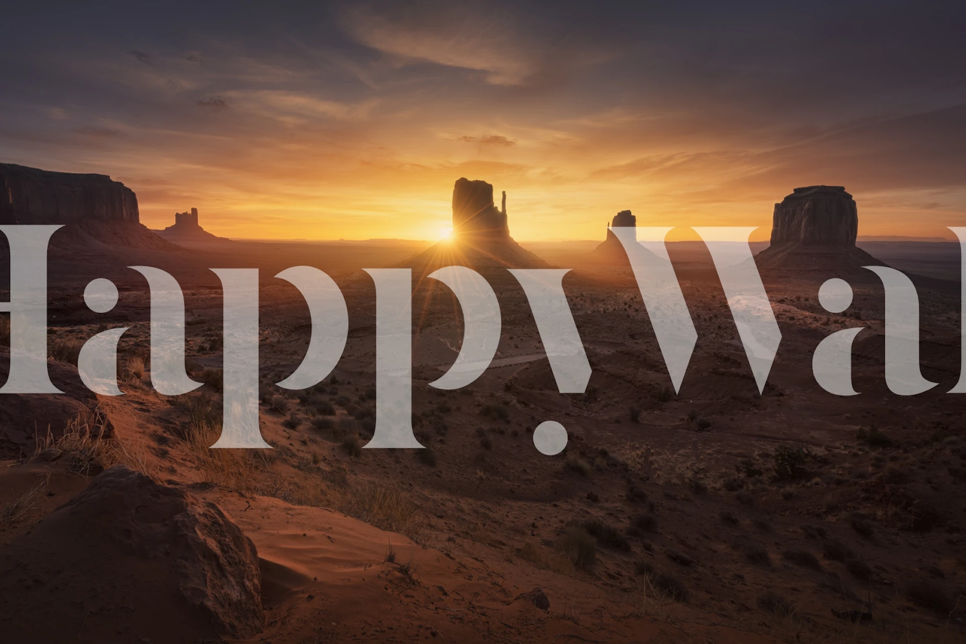 Desert landscape with sunrise over mountains in warm tones wallpaper