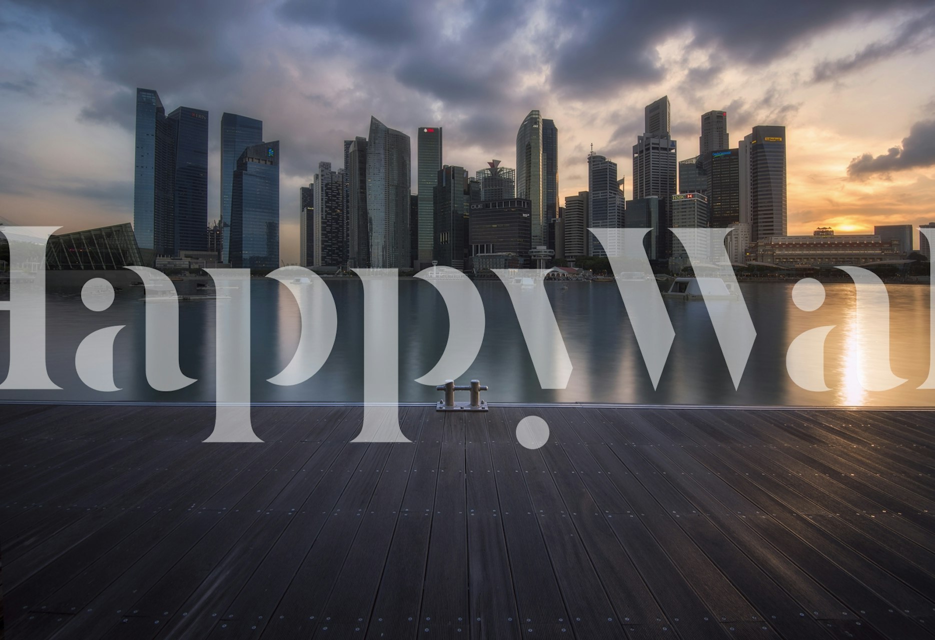 Urban skyline at sunset wallpaper with blue tones and a tranquil water reflection