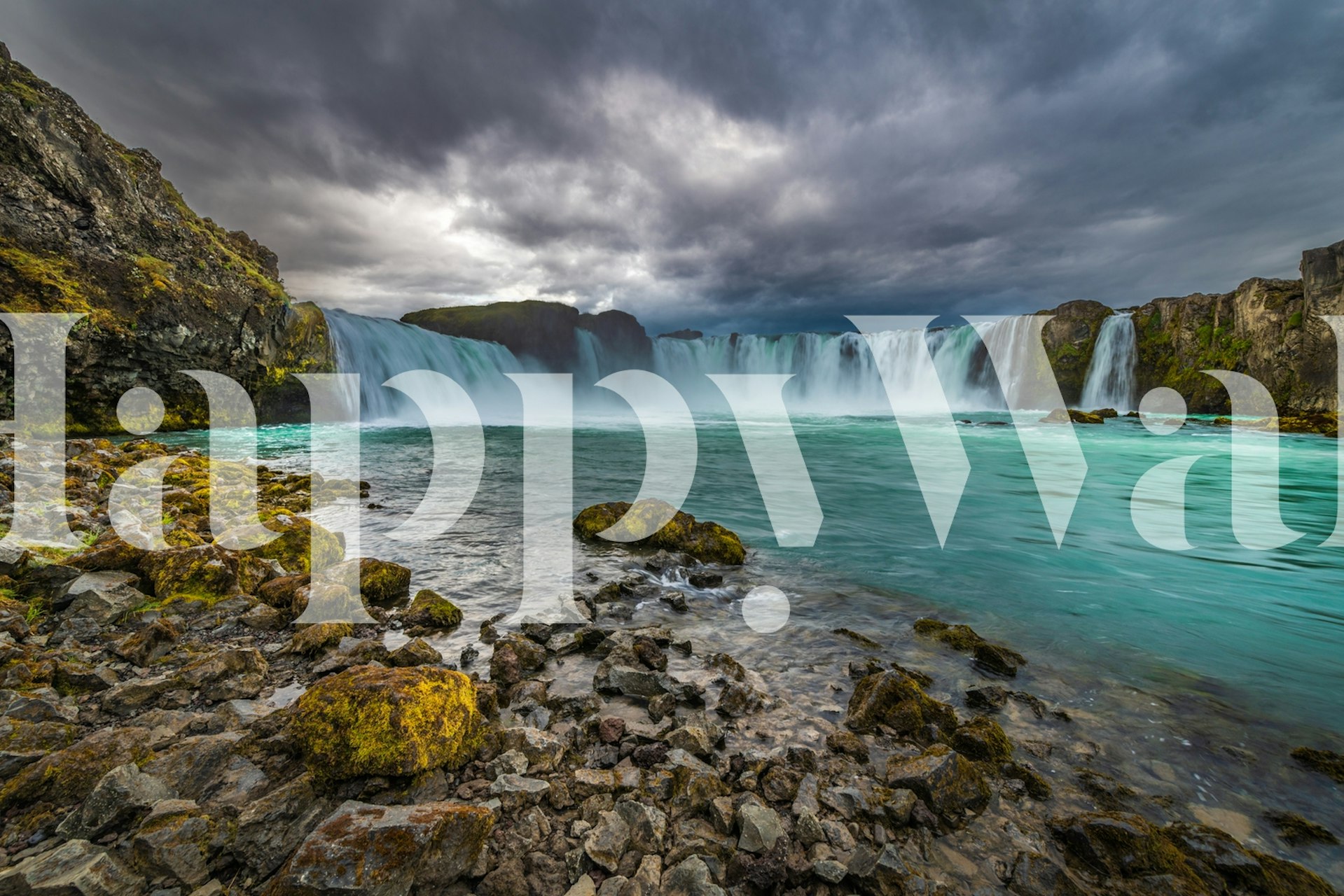 Godafoss waterfall scenery with turquoise water and gray skies wallpaper