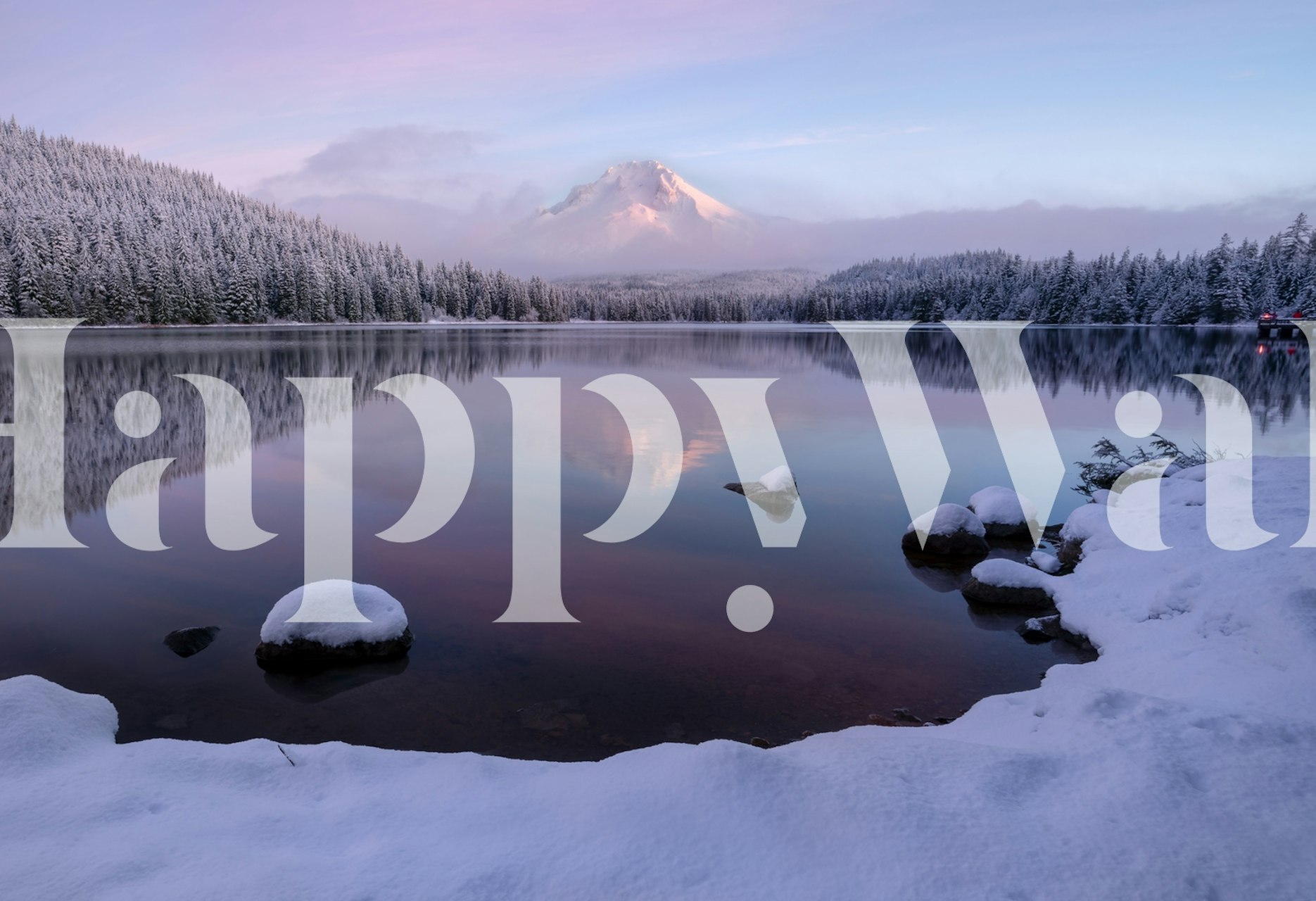 Snowy landscape with a lake, pink skies, and evergreen trees wallpaper