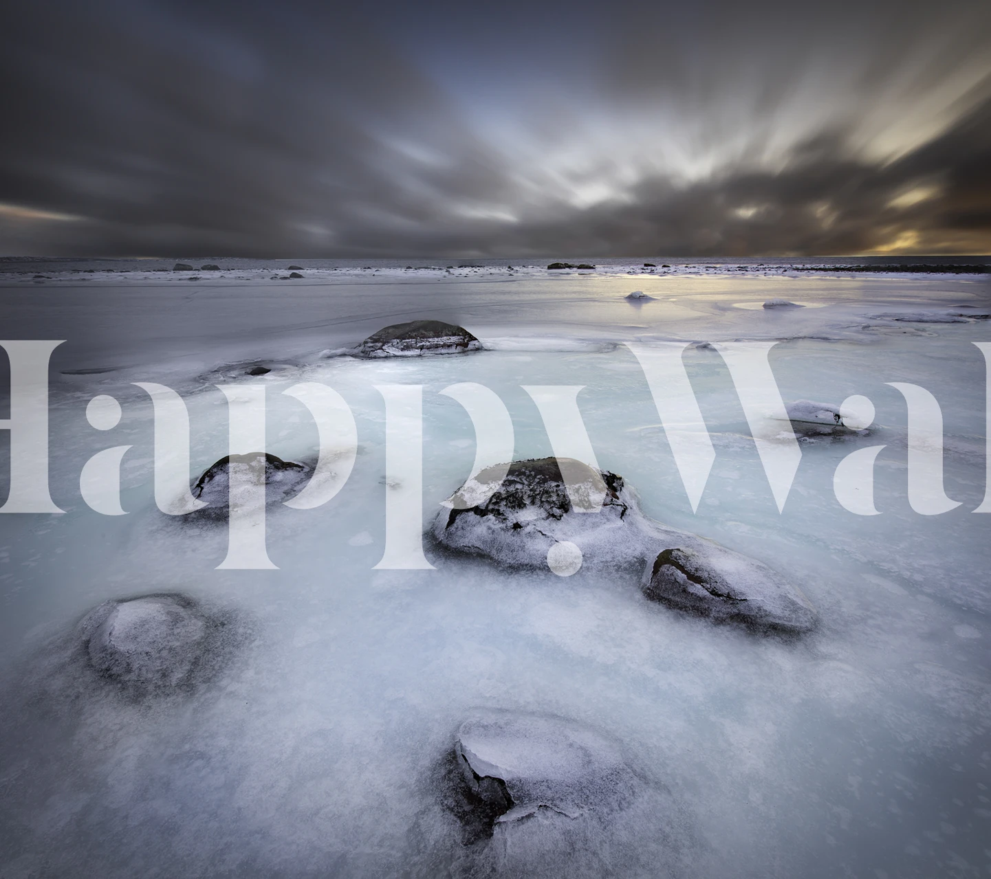 Frozen coastline with icy rocks and blue tones wallpaper