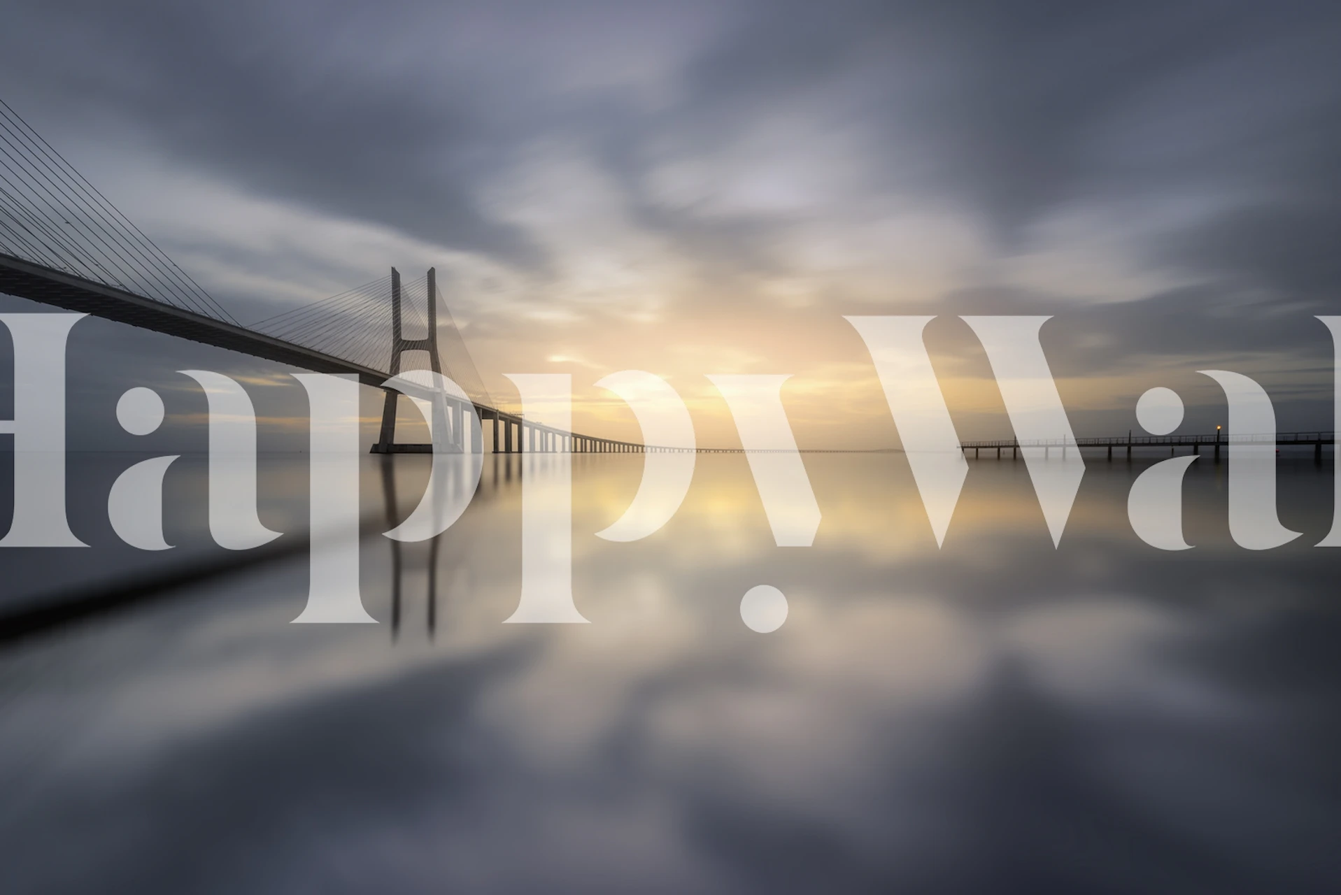 Bridge reflection on water at sunset with soft colors wallpaper