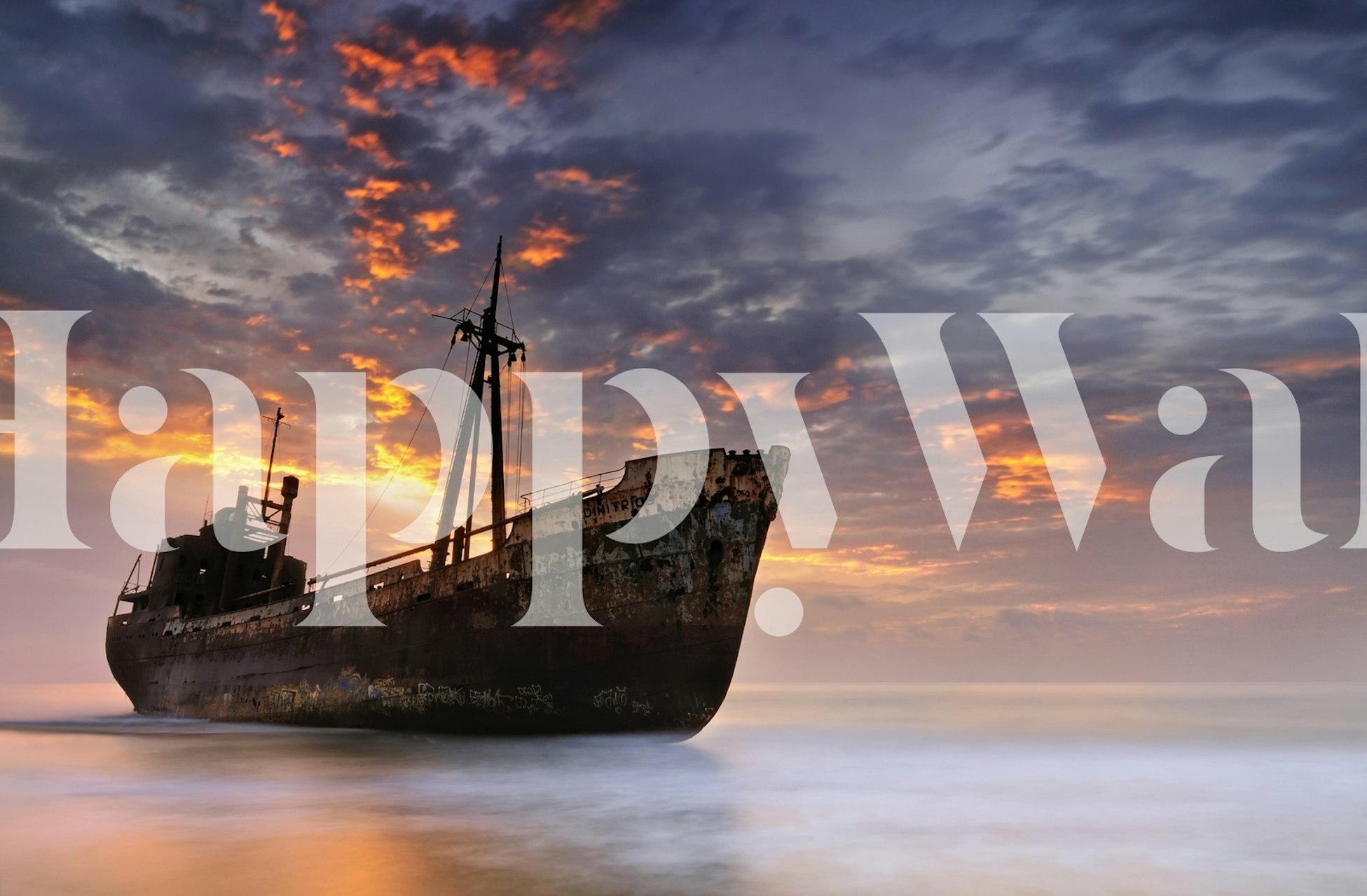Shipwreck silhouette against a colorful sunset sky wallpaper