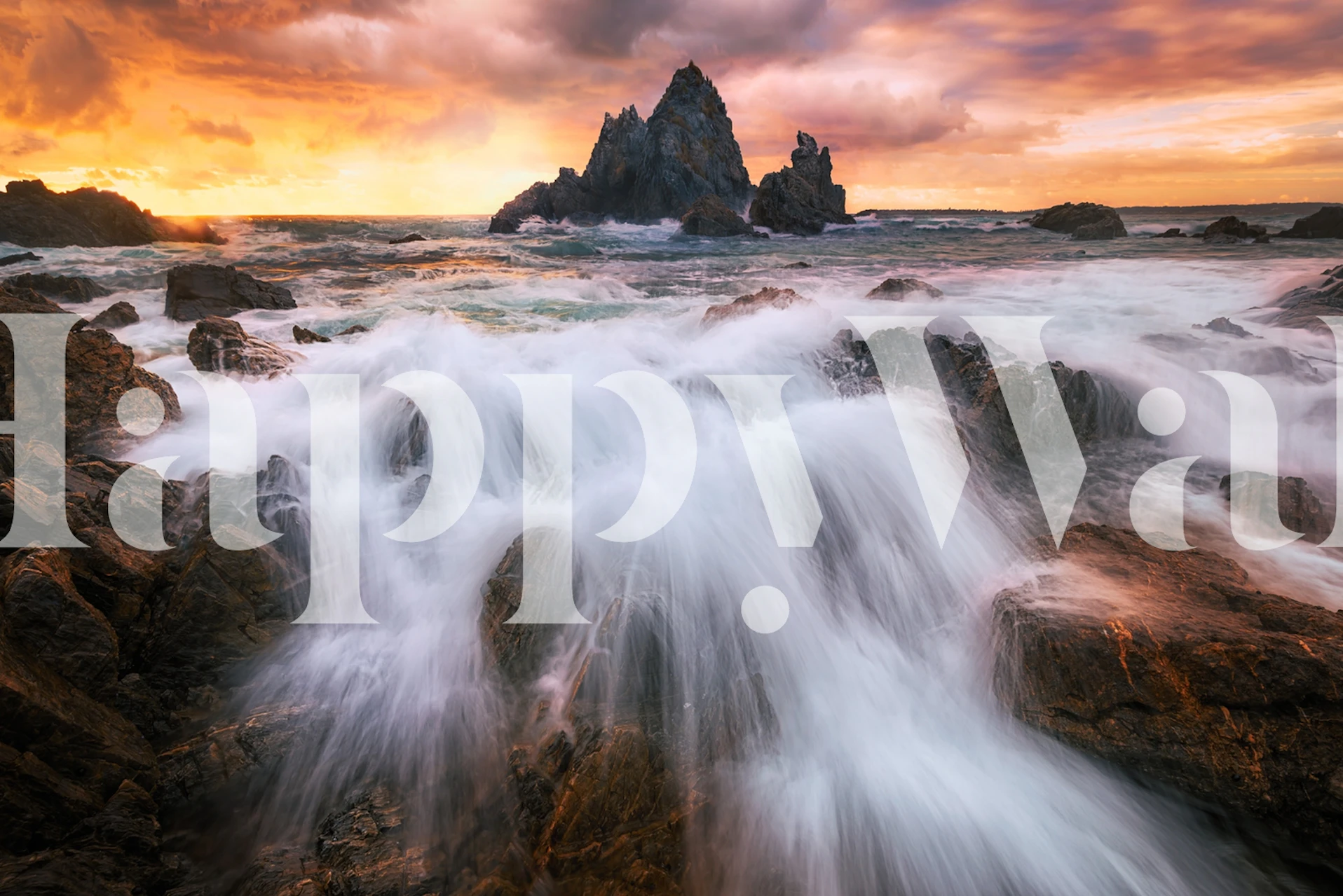 Rushing ocean waves over rocks at sunset wallpaper