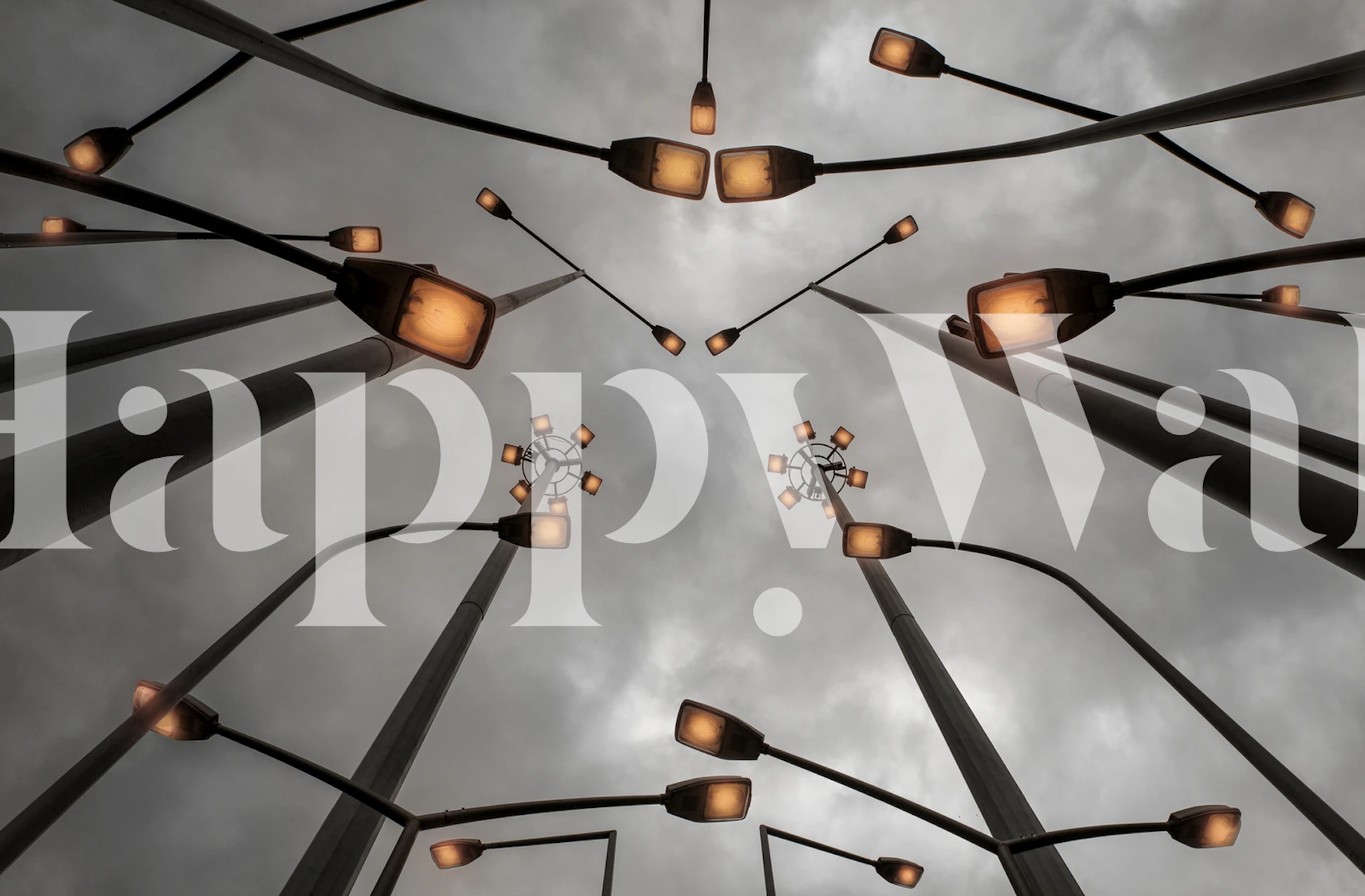 Streetlamps against a moody gray sky wallpaper