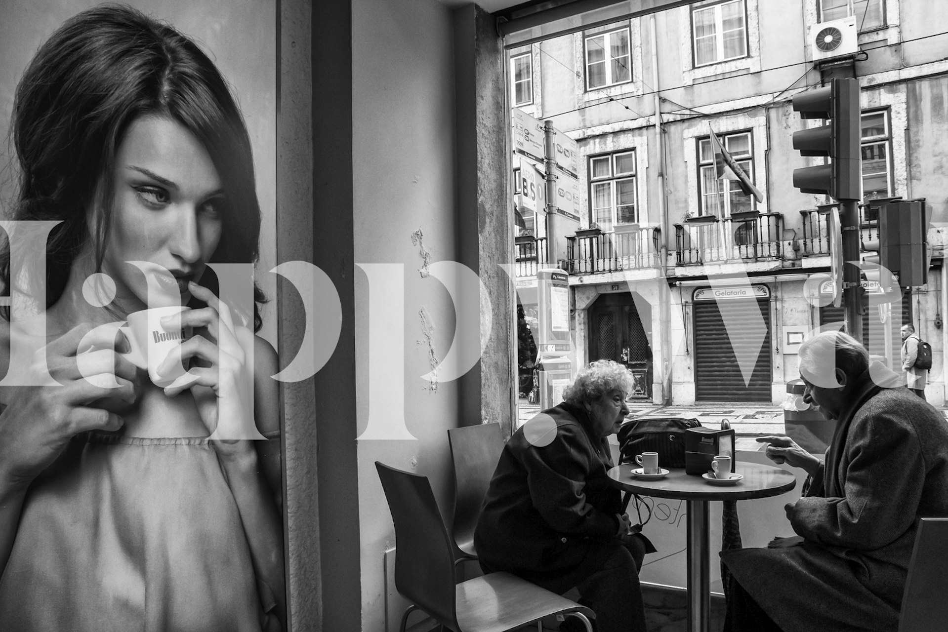 Black and white wall mural depicting coffee shop scene with people conversing and a woman drinking coffee.