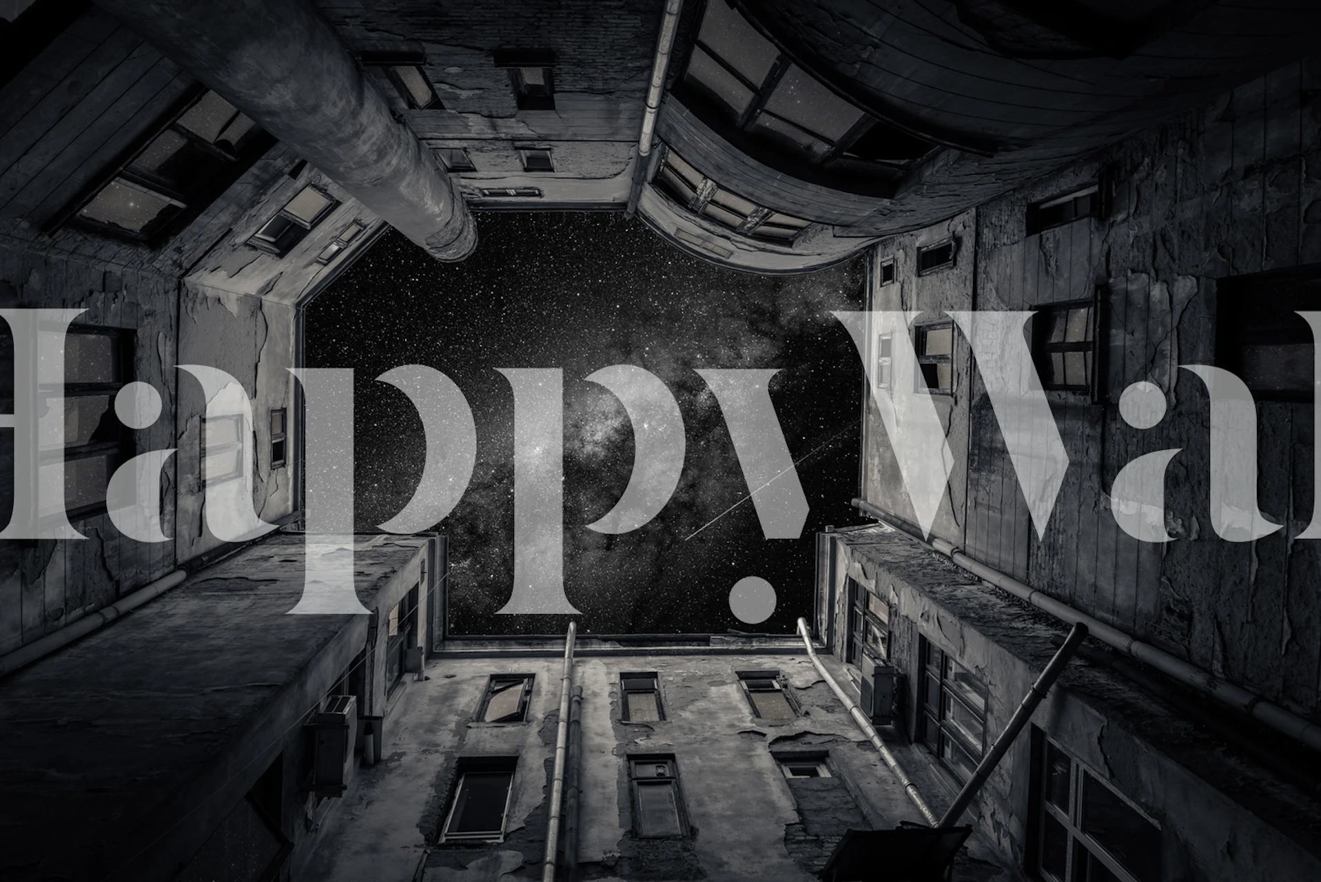 Black and white wallpaper showing a galaxy view from an urban alleyway