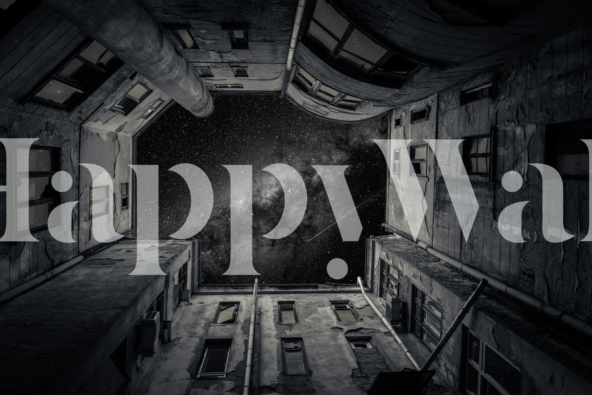 Black and white wallpaper showing a galaxy view from an urban alleyway